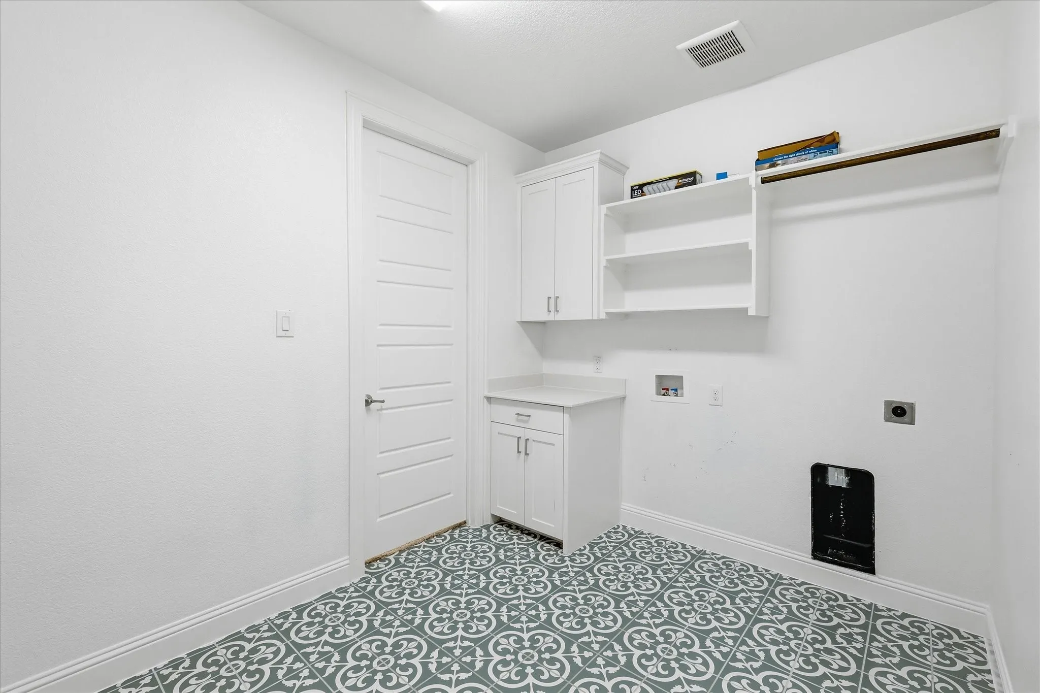 Dedicated laundry connects to primary closet!
