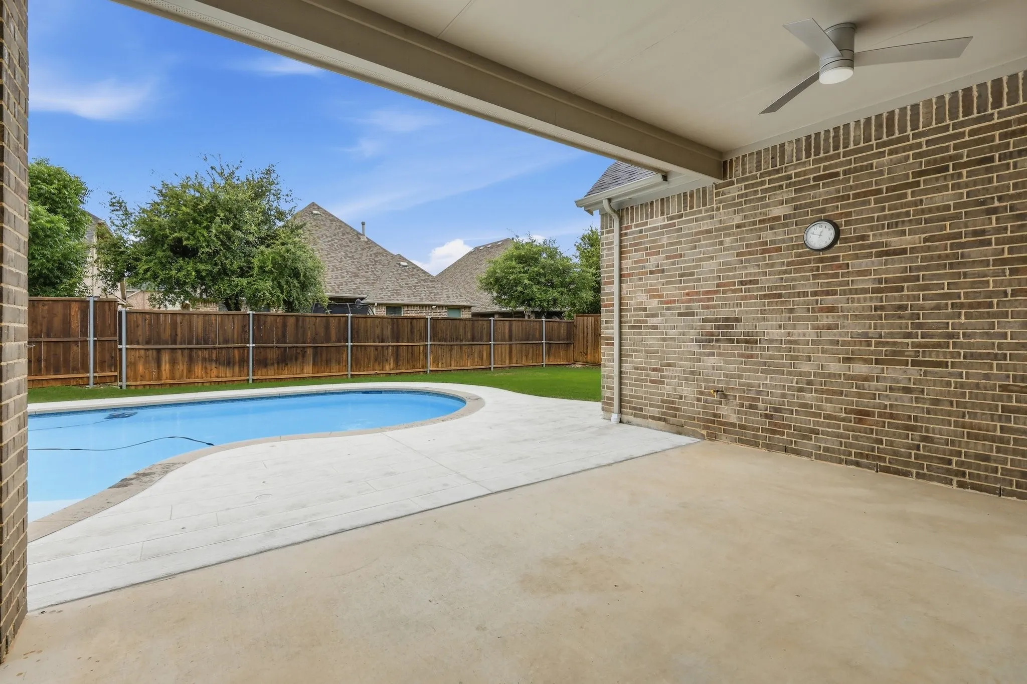 Covered outdoor patio is your white canvas! Kitchen, living area, whatever you want!