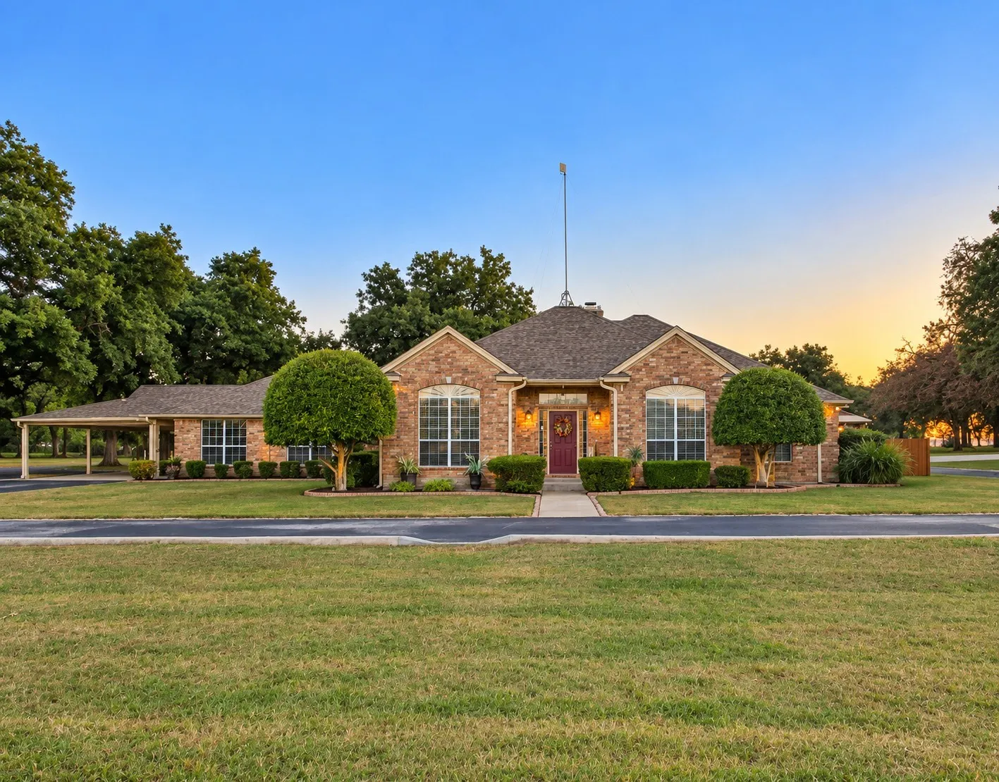 Front of house with exterior lighting.