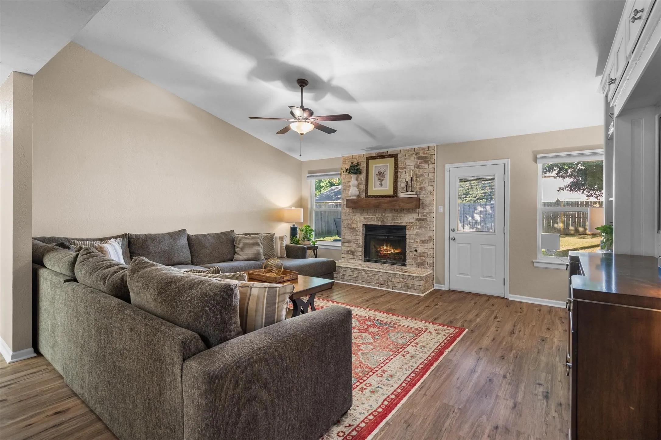 Wood-look floors run through the living room.