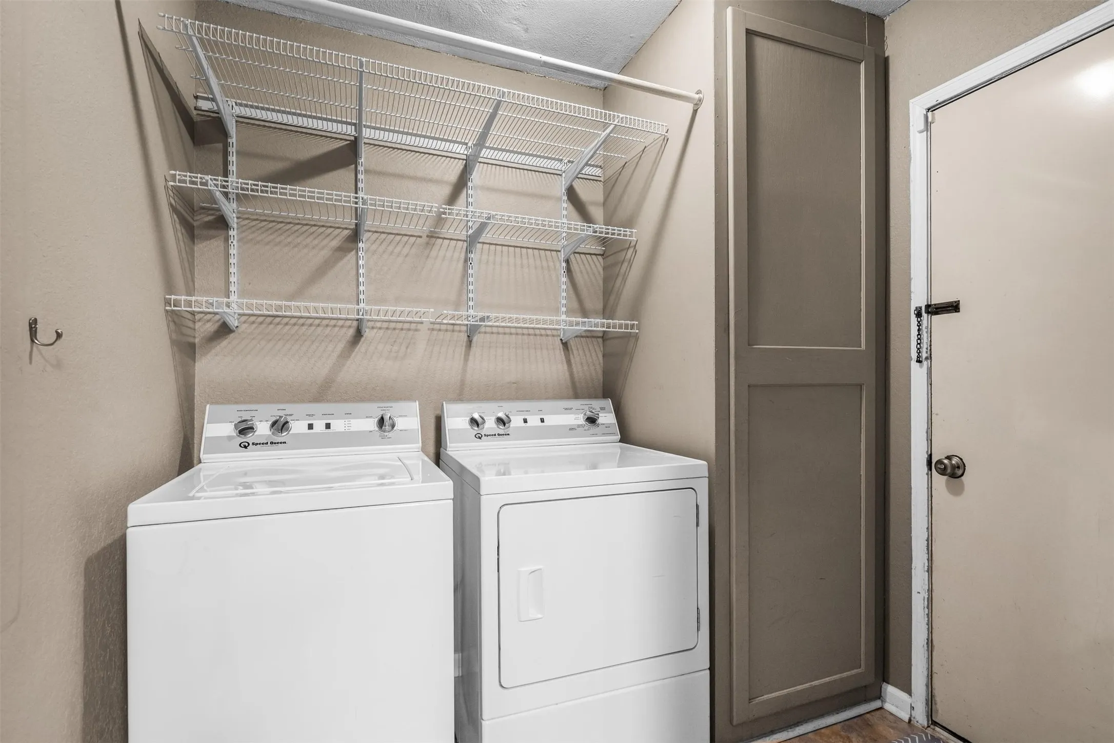 Separate utility room with space for a full-size washer and dryer.