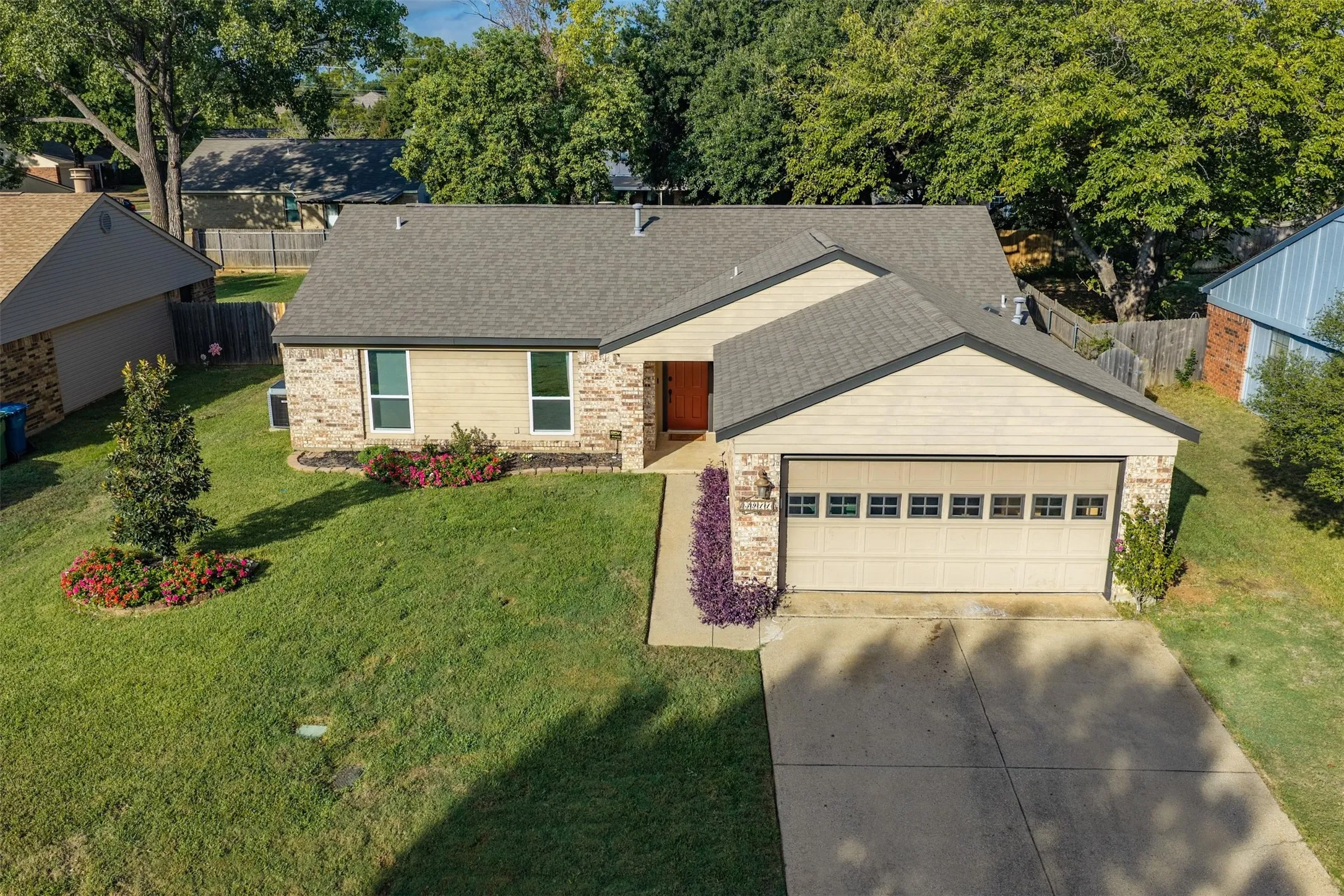 The home from above with its big fenced backyard.