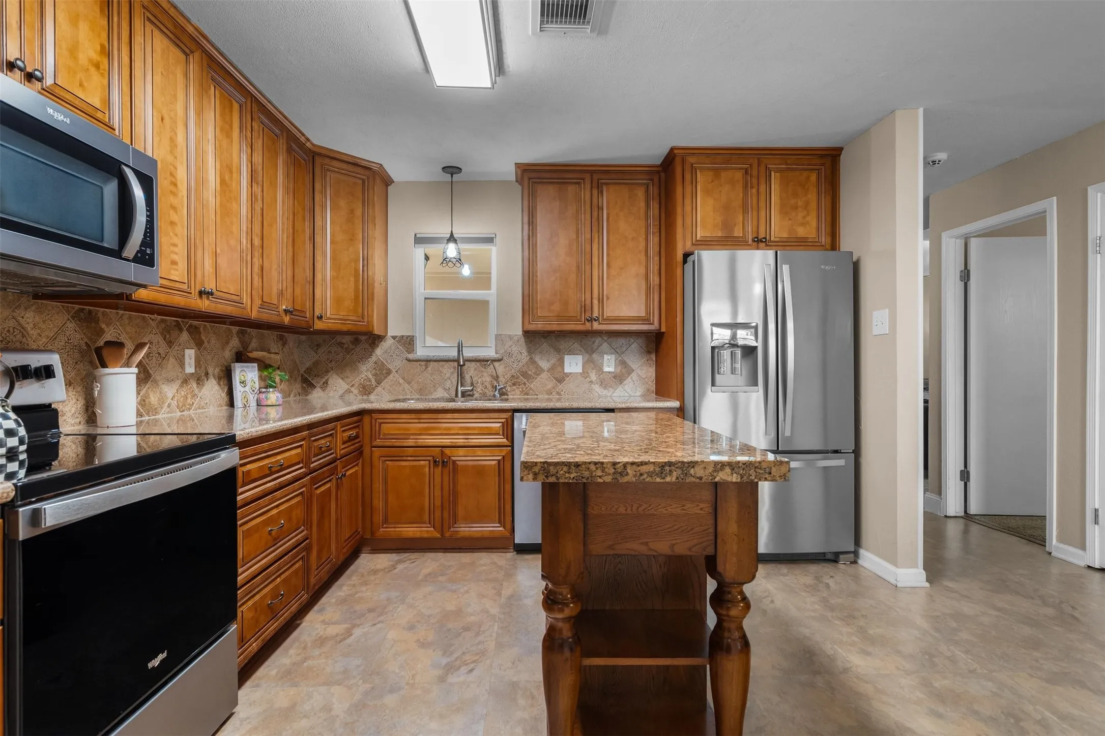 The kitchen sits at the center of the home.