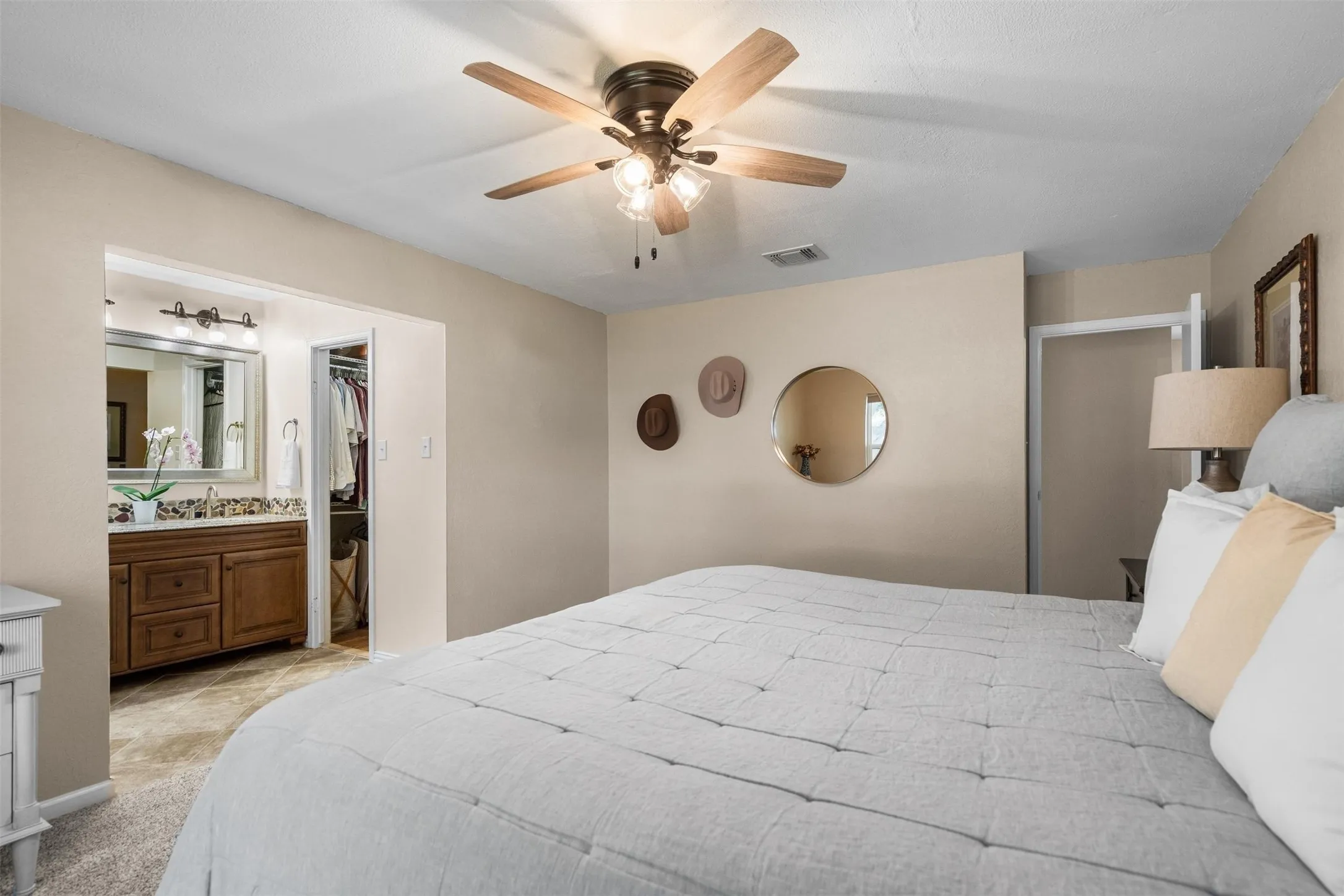 Primary suite with its own bath and walk-in closet.