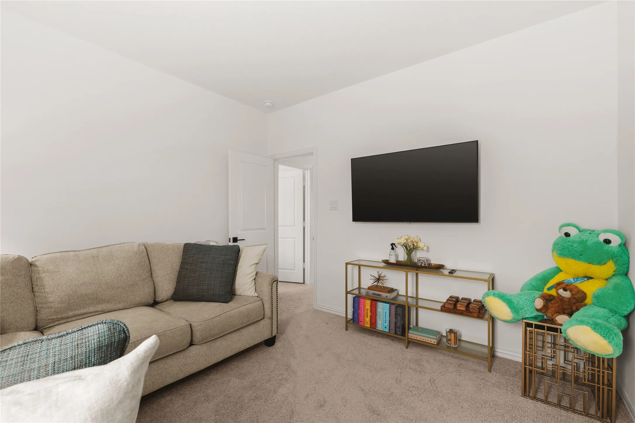 Neutral-toned wall-to-wall carpeting and crisp white interior paint finish