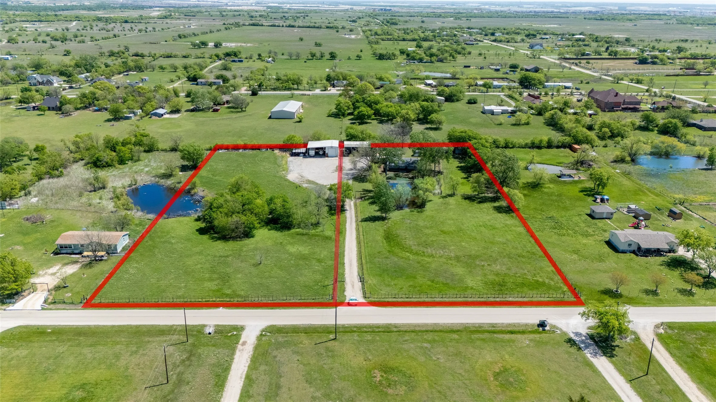 Aerial perspective of estimated boundaries. The lot on the left is the current listing, the right side is a residential listing.