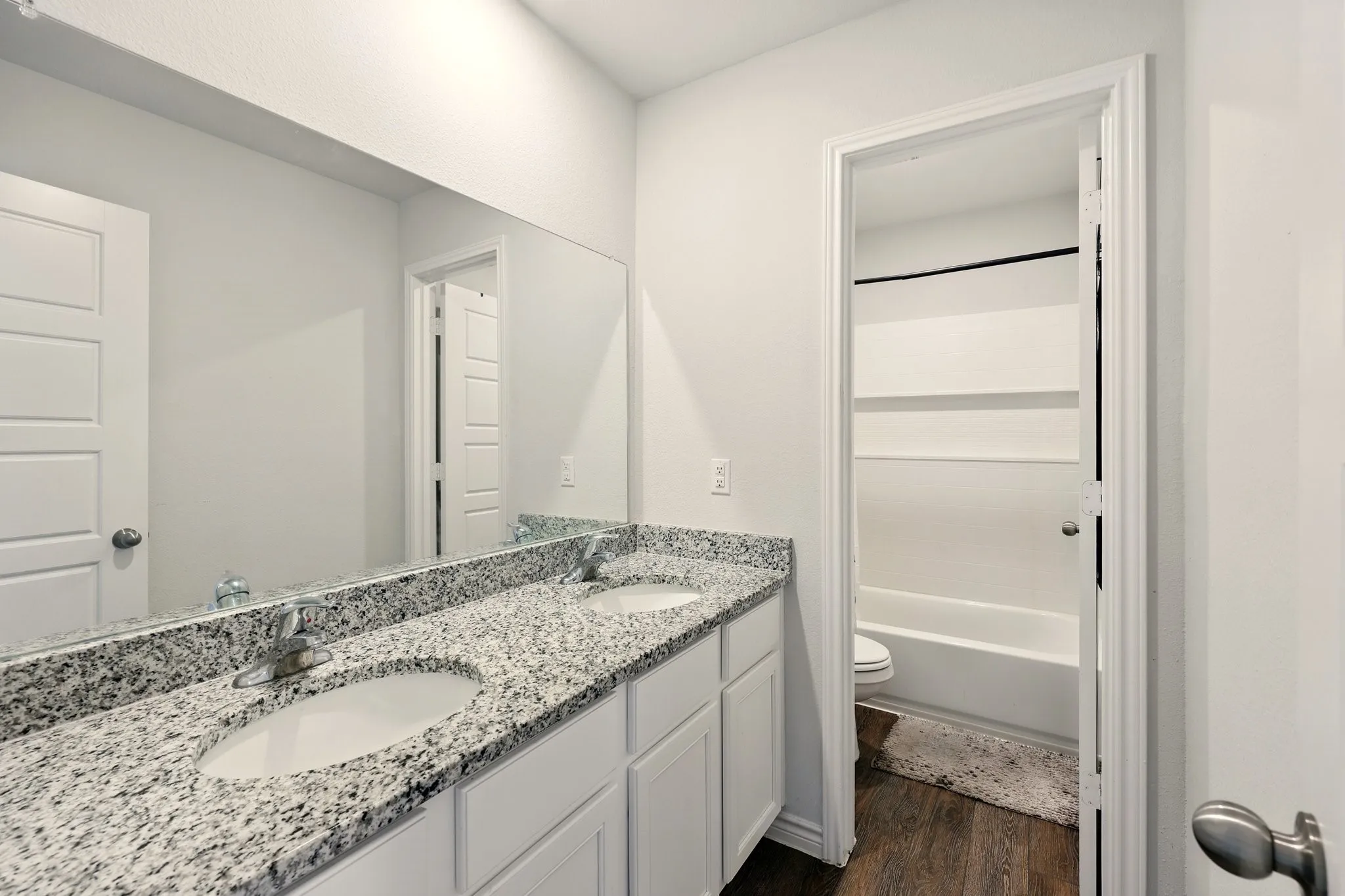 Dual vanity with granite countertop and undermount sinks