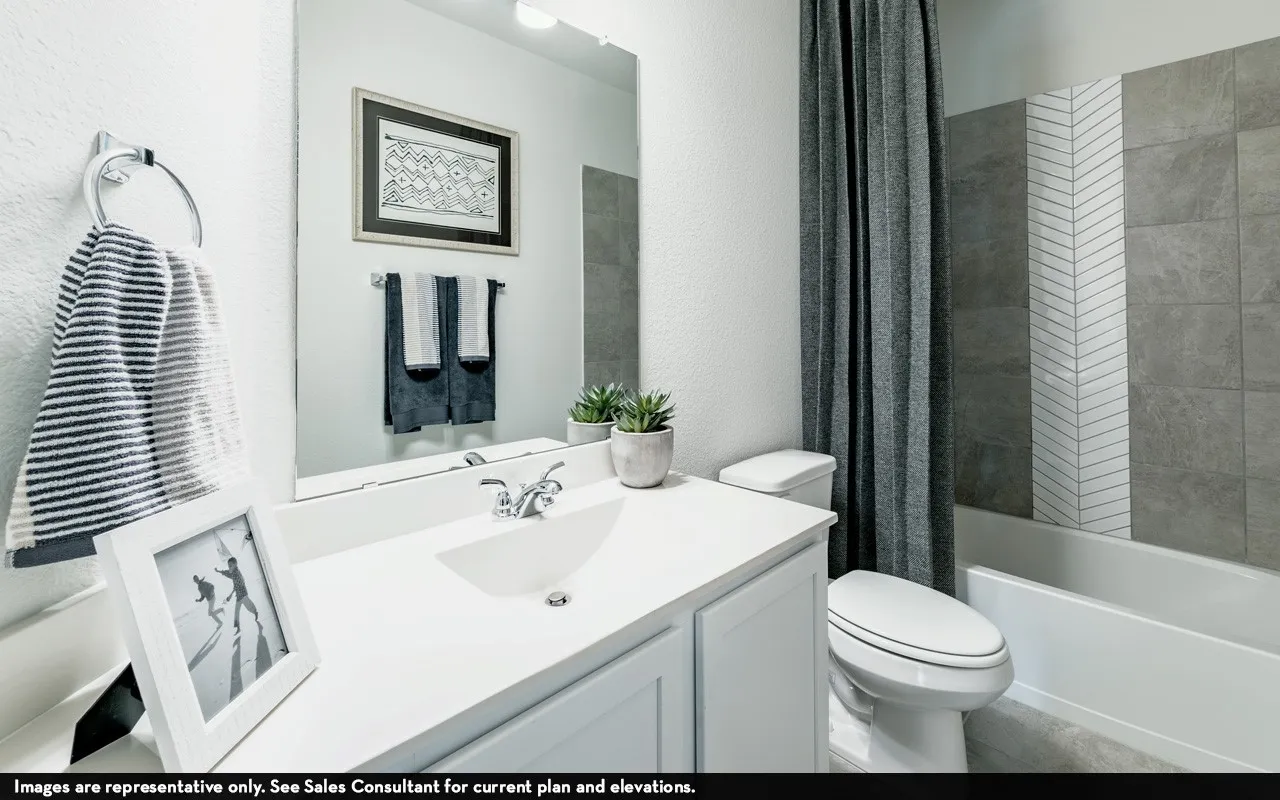 White vanity with an integrated sink and chrome faucet