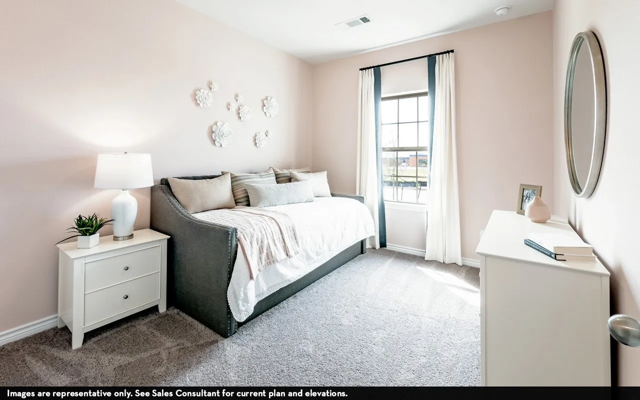 Window with dark trim, light-colored walls, and gray carpeted flooring