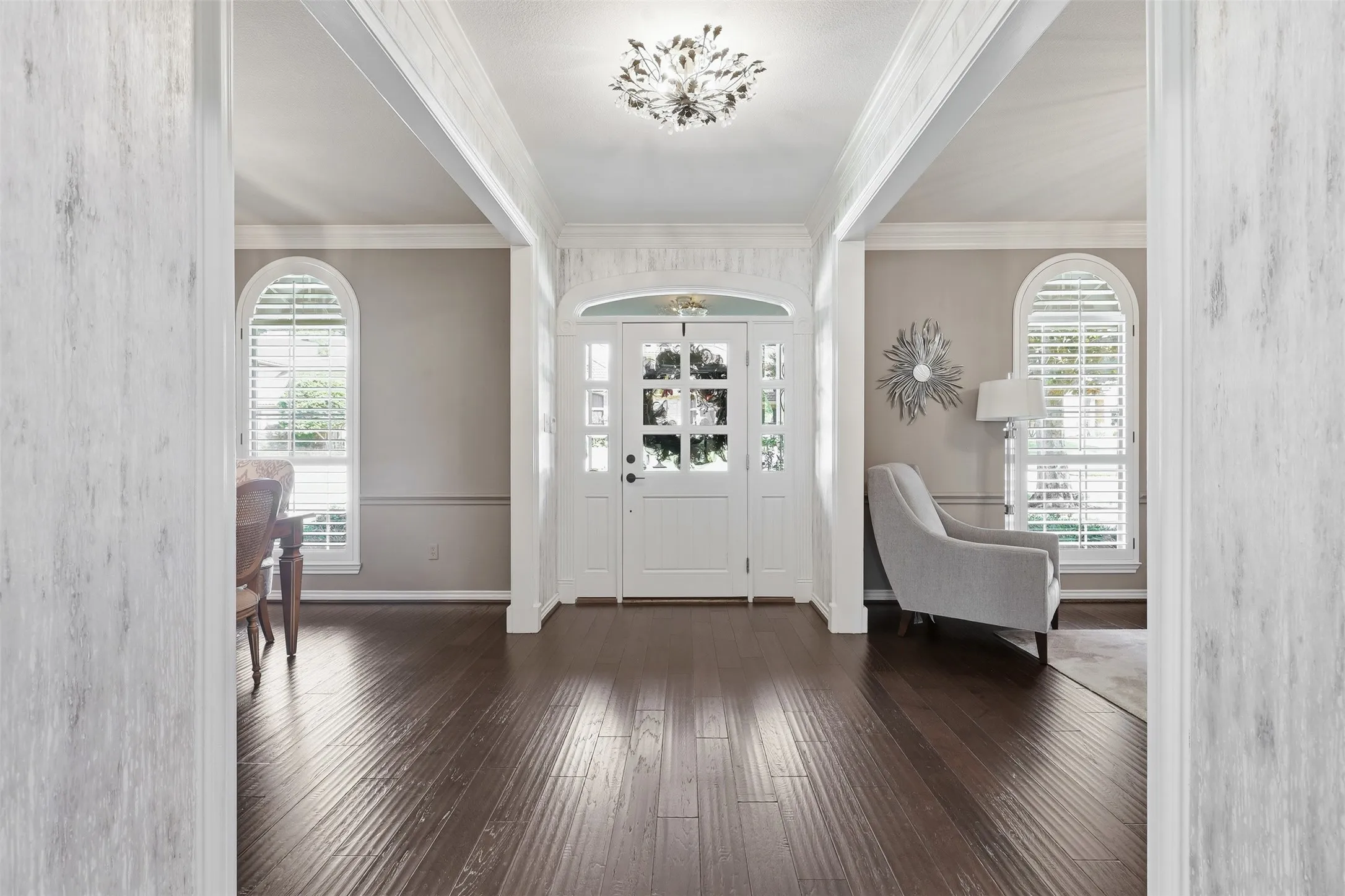 Large entry hall between formal living and dining