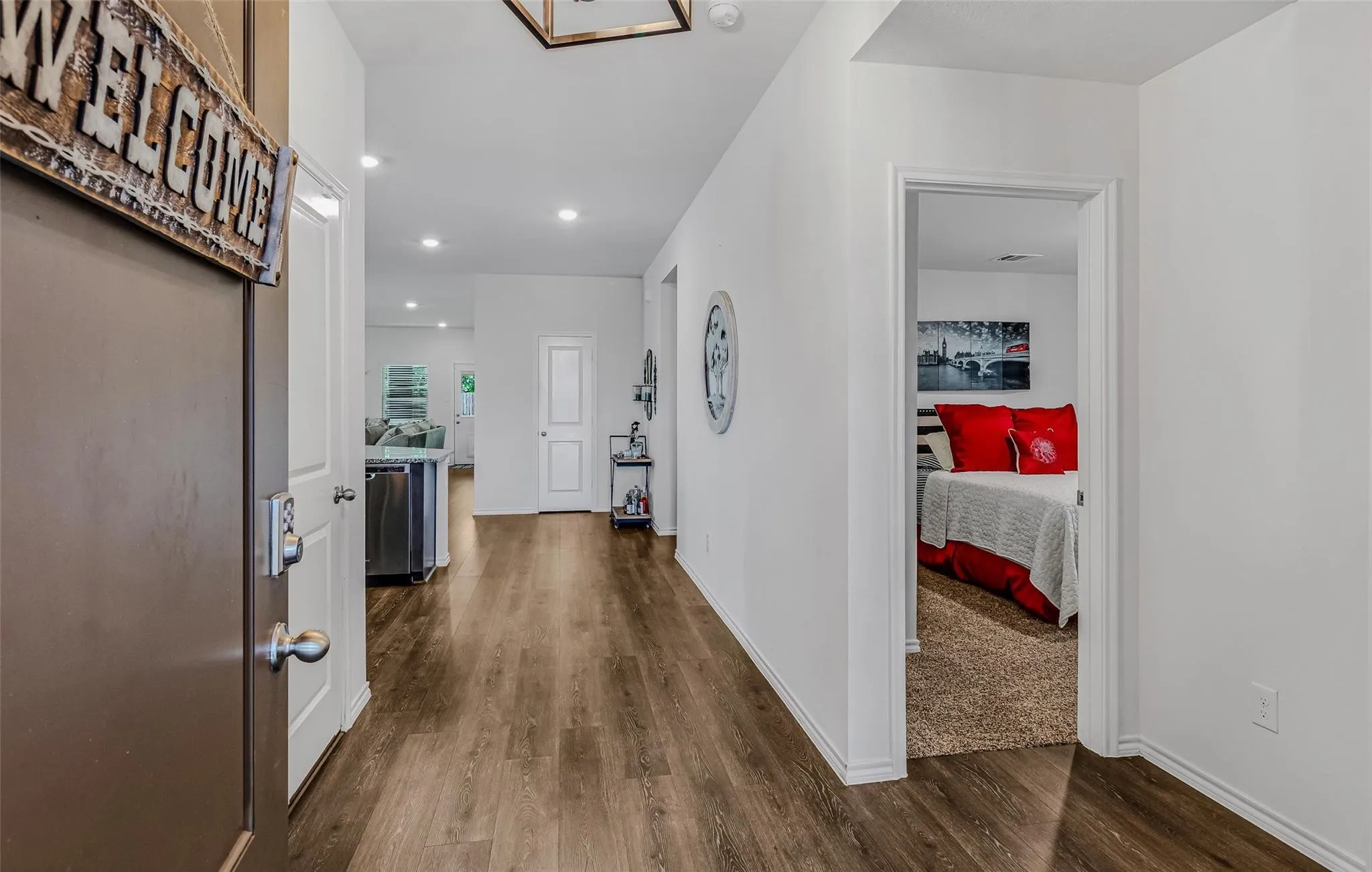 Hallway with dark wood-type flooring