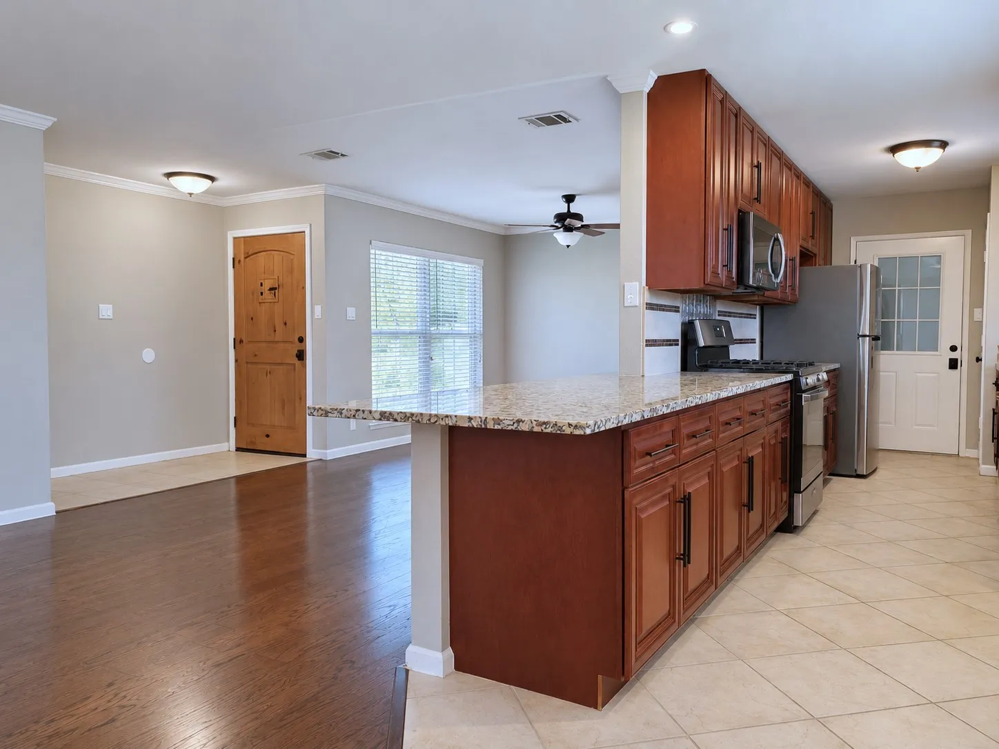 Granite countertops, gas range, refrigerator included