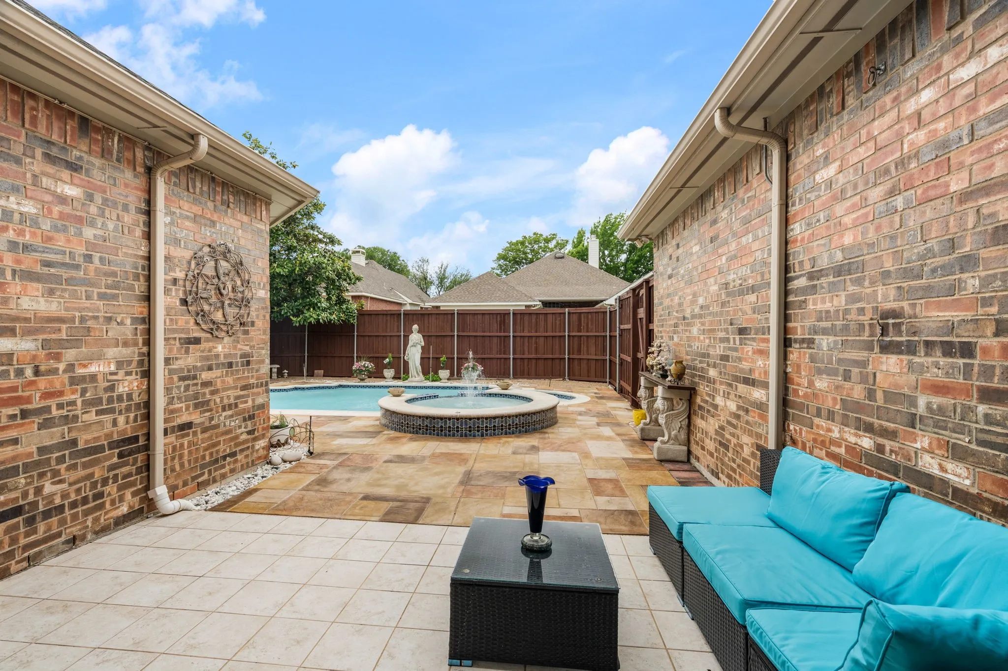 Private outdoor space featuring a swimming pool, integrated spa, and expansive patio area