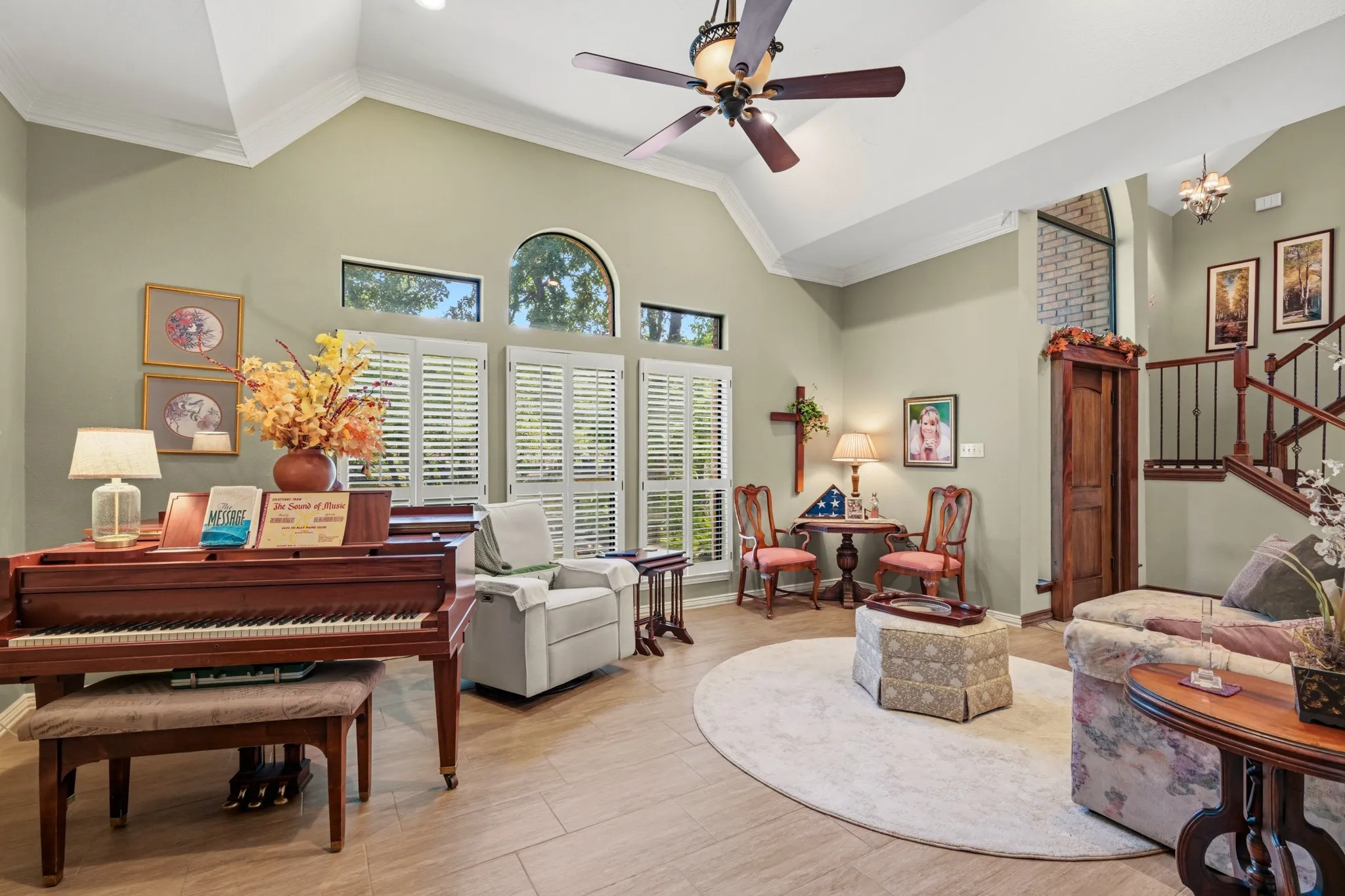 Timeless architectural details and soft, neutral-green walls complete this charming space. Perfect for entertaining guests or enjoying a quiet moment.