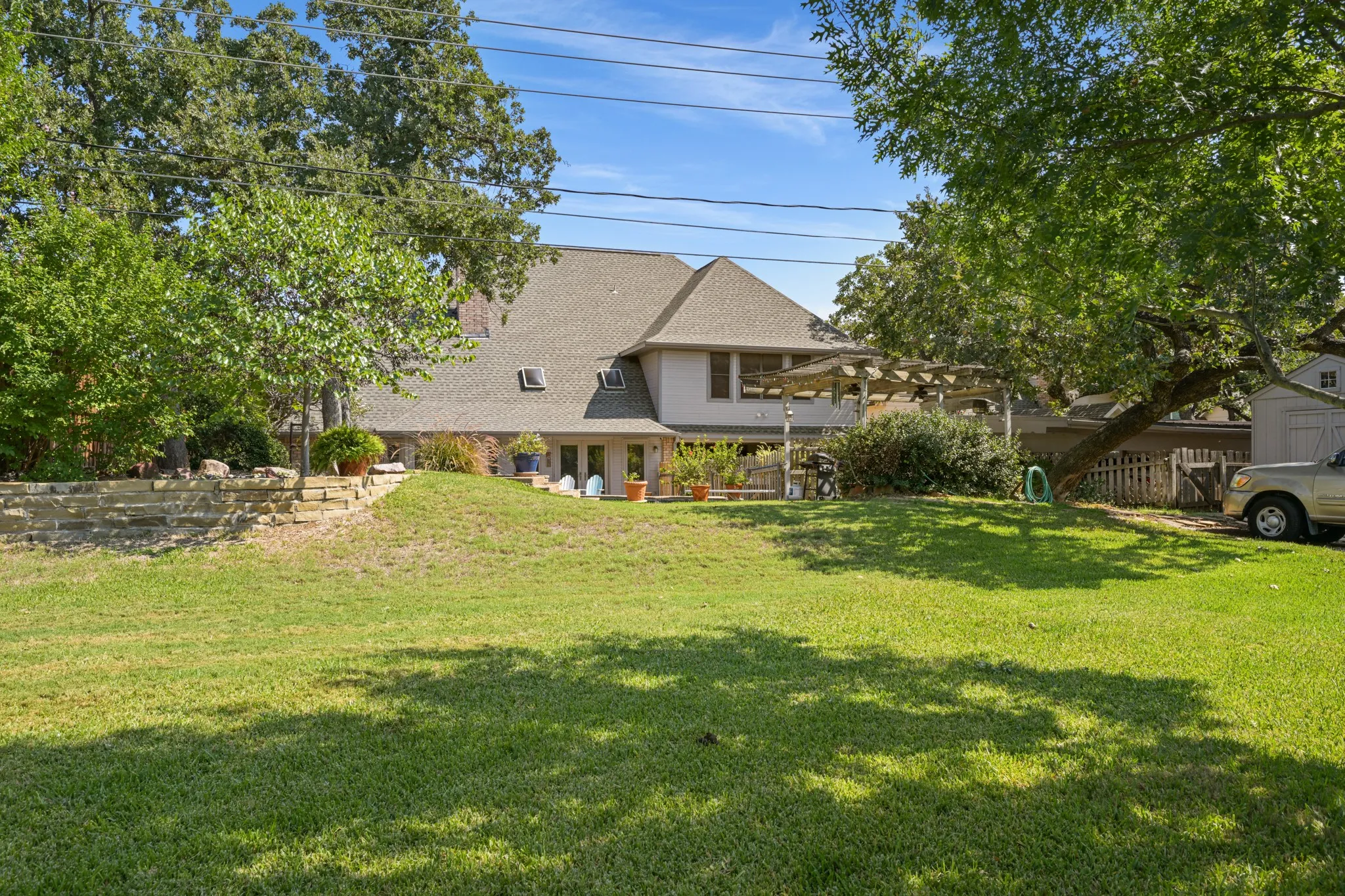 Backyard has a good amount of space for outdoor entertaining and play.