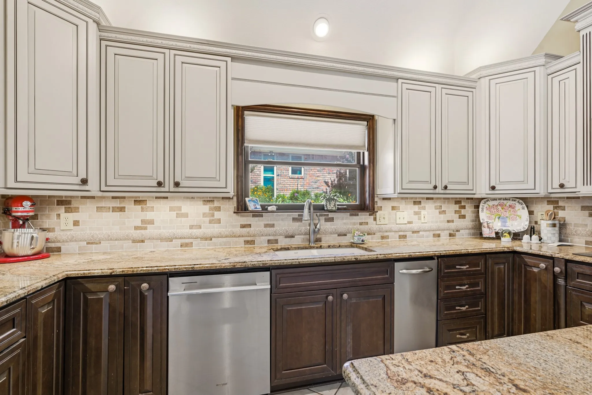 Generous counter space and extensive storage create a functional and inviting kitchen for everyday cooking and entertaining.