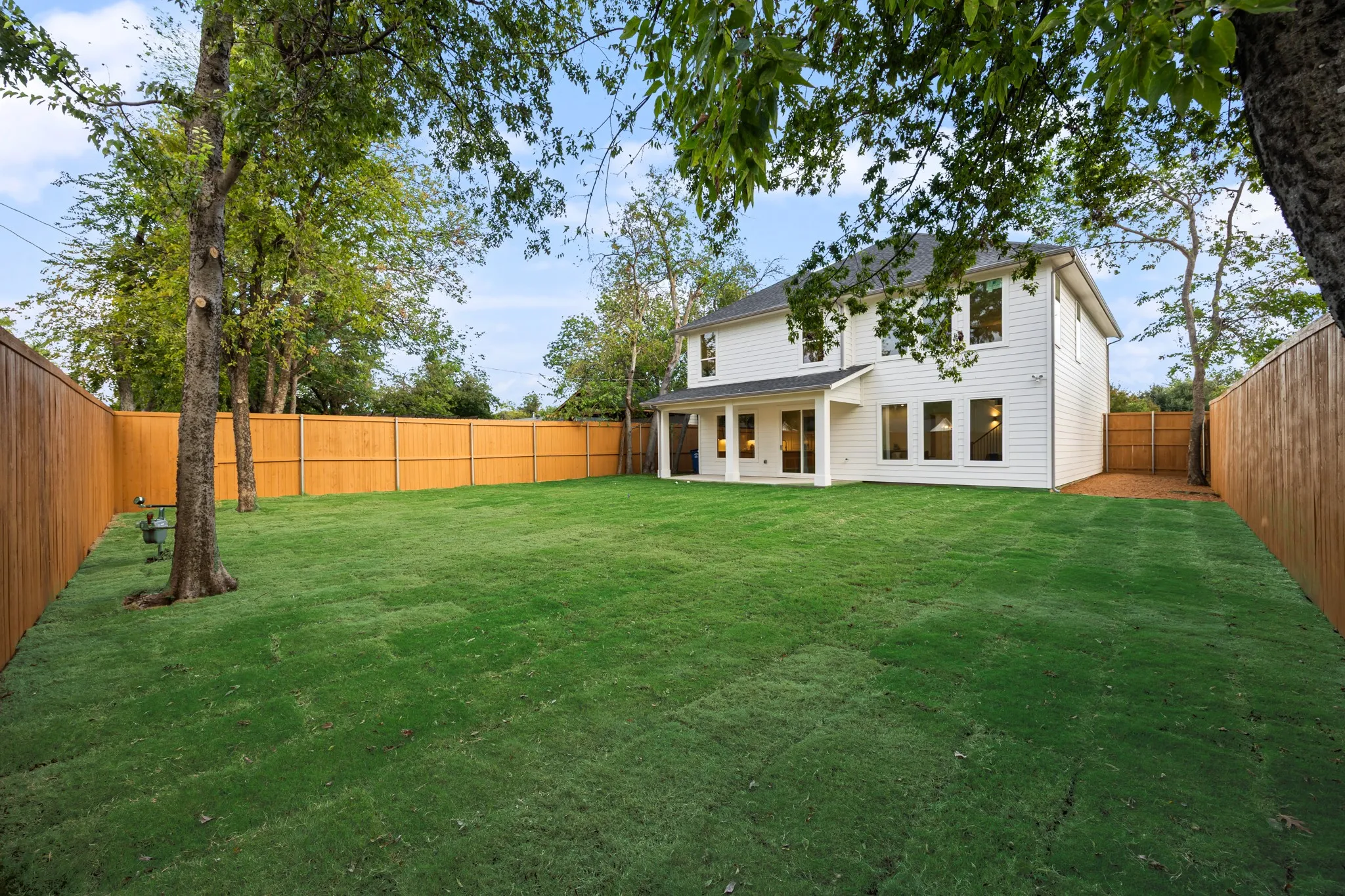 Massive yard with existing mature trees.