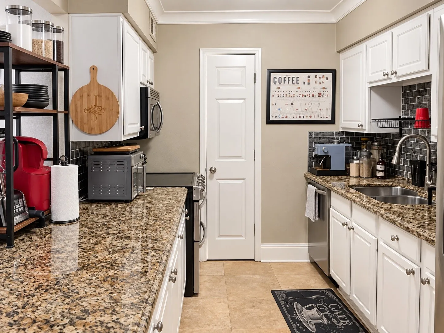 Kitchen featuring white cabinetry, stone-finish countertops, subway tile backsplash, stainless steel sink with gooseneck faucet, and tile flooring