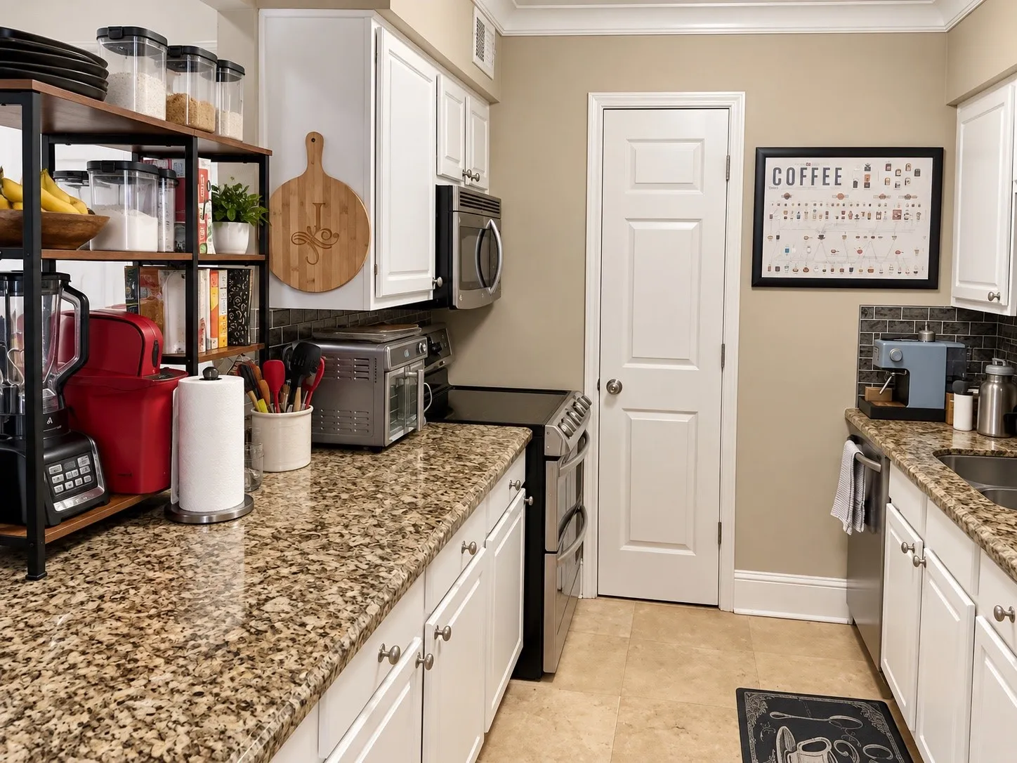 Kitchen featuring white shaker-style cabinetry, stone-finish countertops, stainless steel appliances, and dark tile backsplash