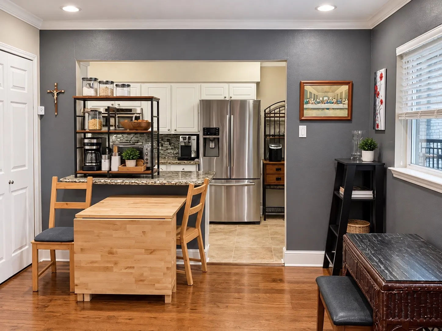 Kitchen featuring white cabinetry, stone countertops, stainless steel refrigerator, and recessed lighting, with wood-finish flooring