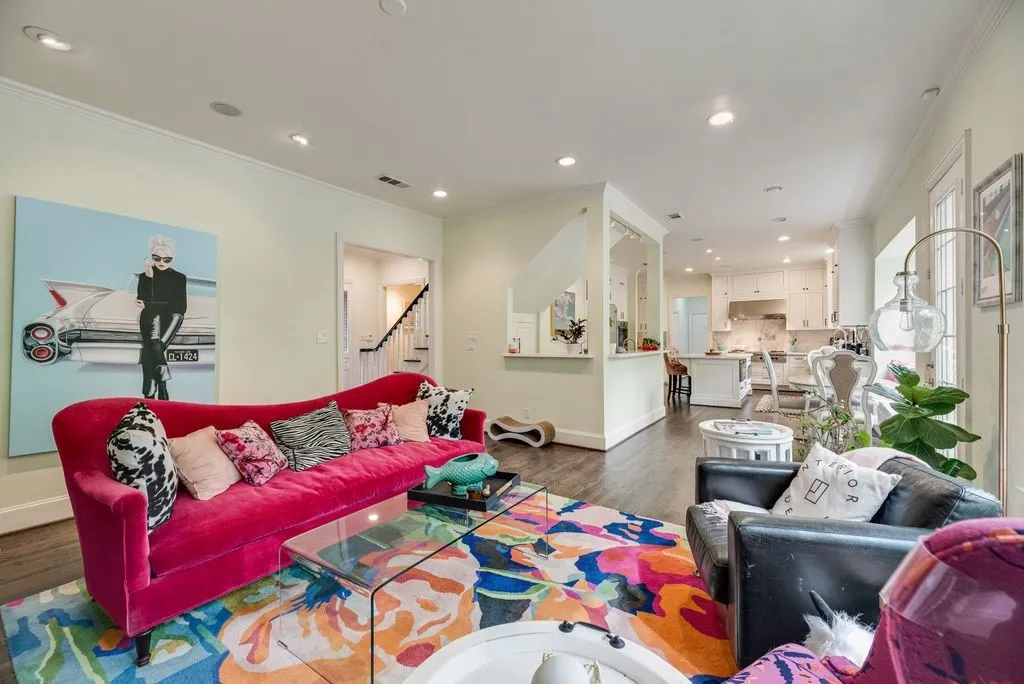 Open-concept interior featuring wood-finish flooring, recessed lighting, and crown molding