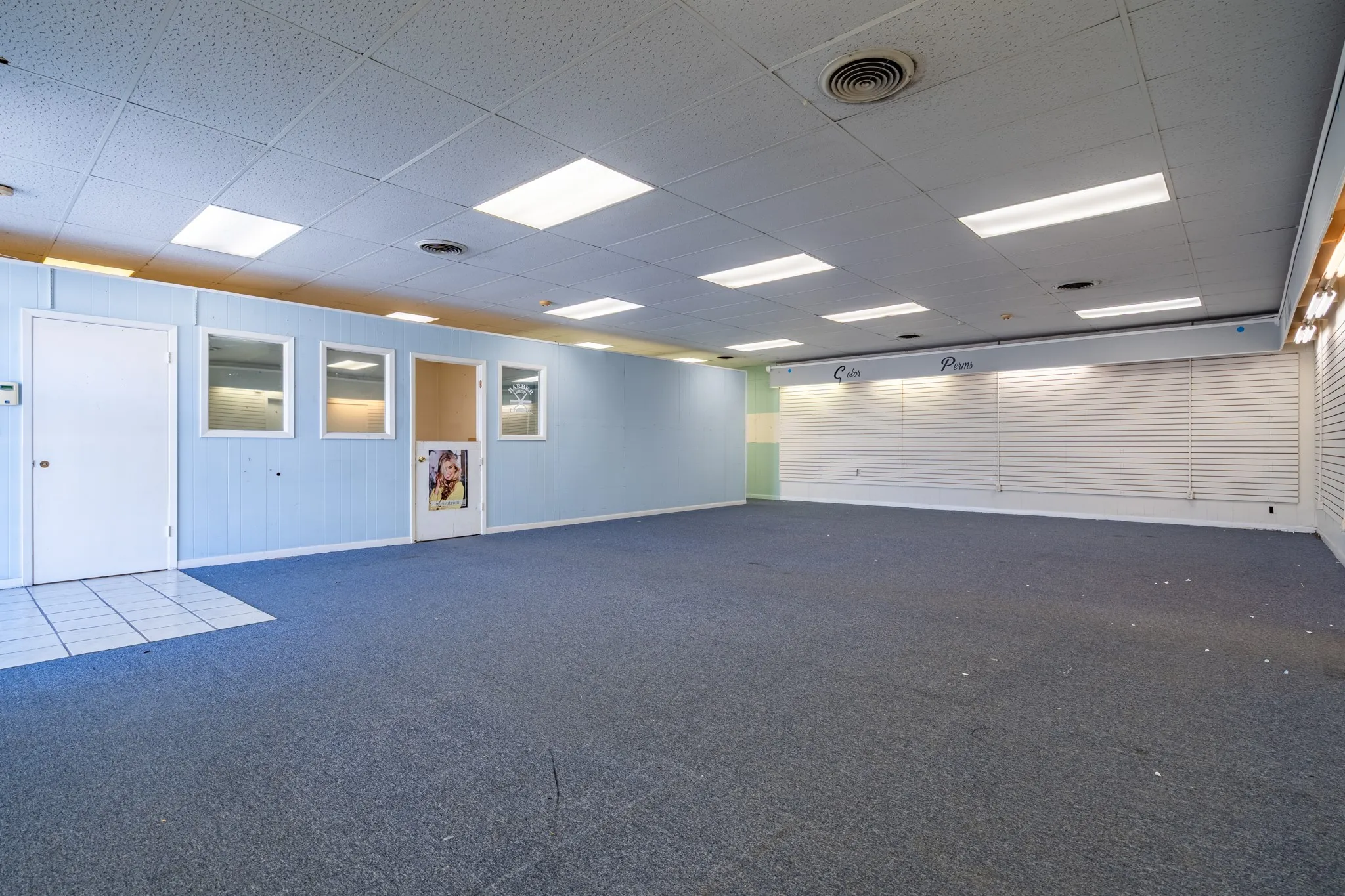 Offices set up on the side, but this space is waiting for you to finish it for your business.