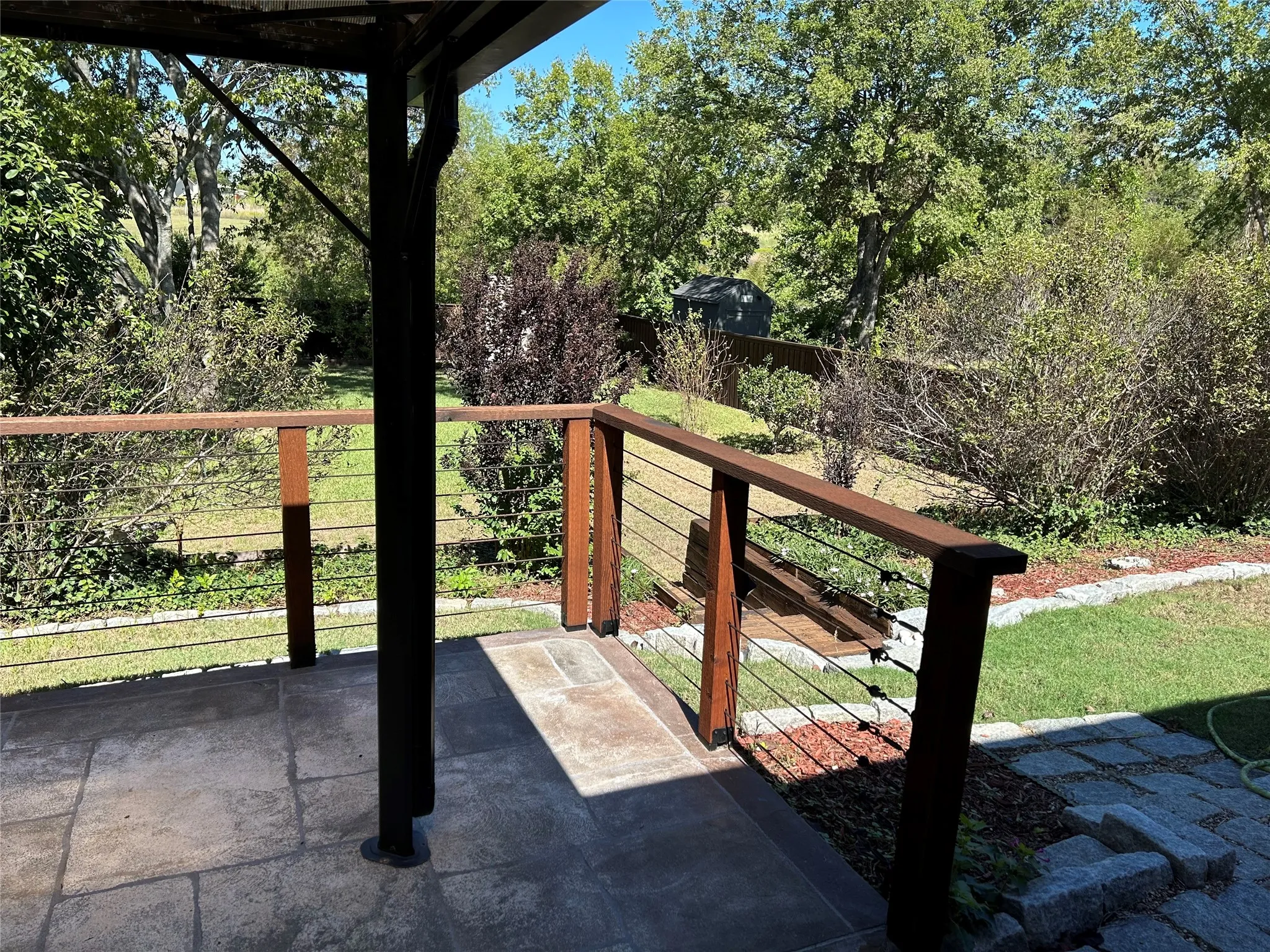 View of backyard from covered patio