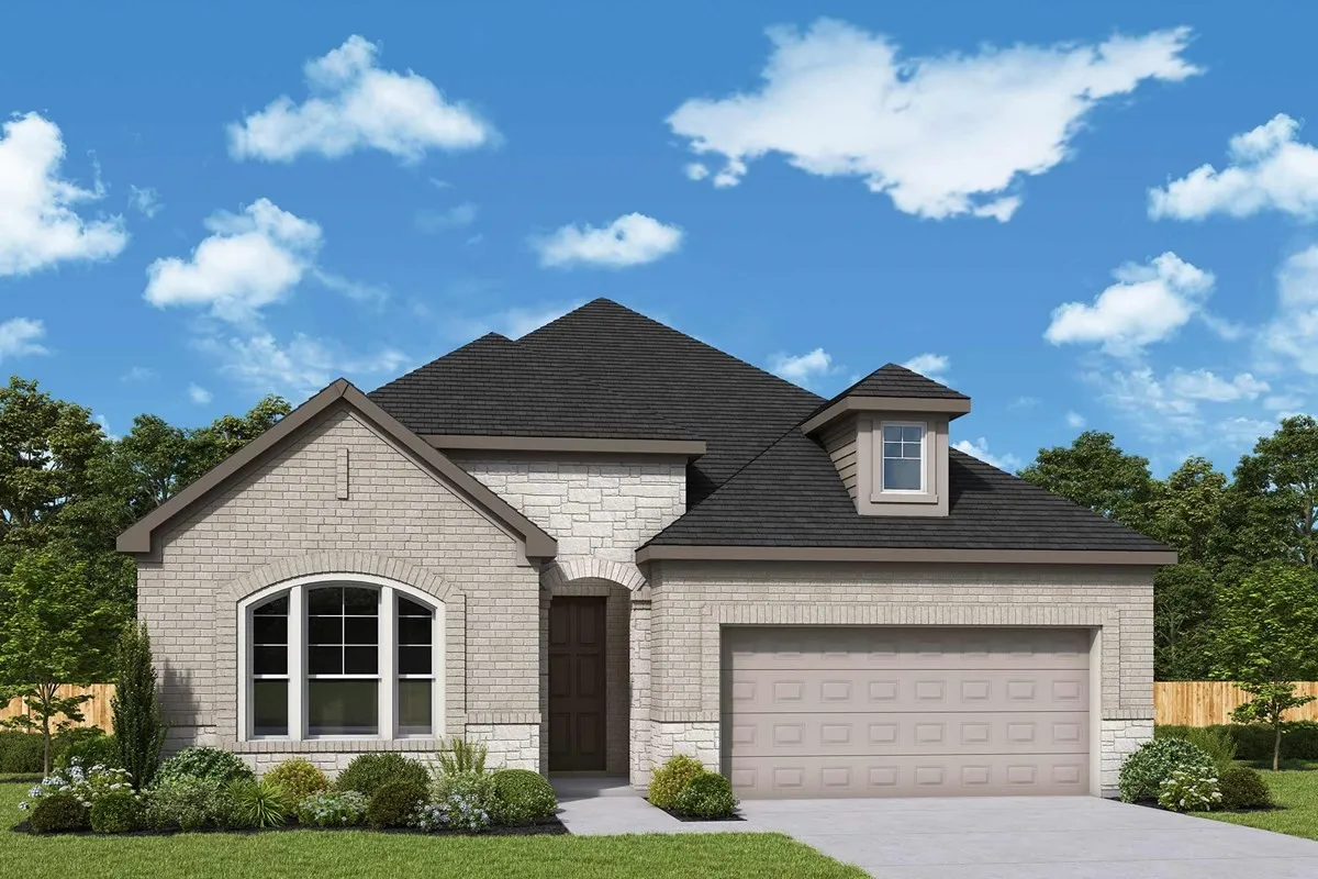 Single-story brick and stone facade featuring an arched window, a roof dormer, and a multi-car garage