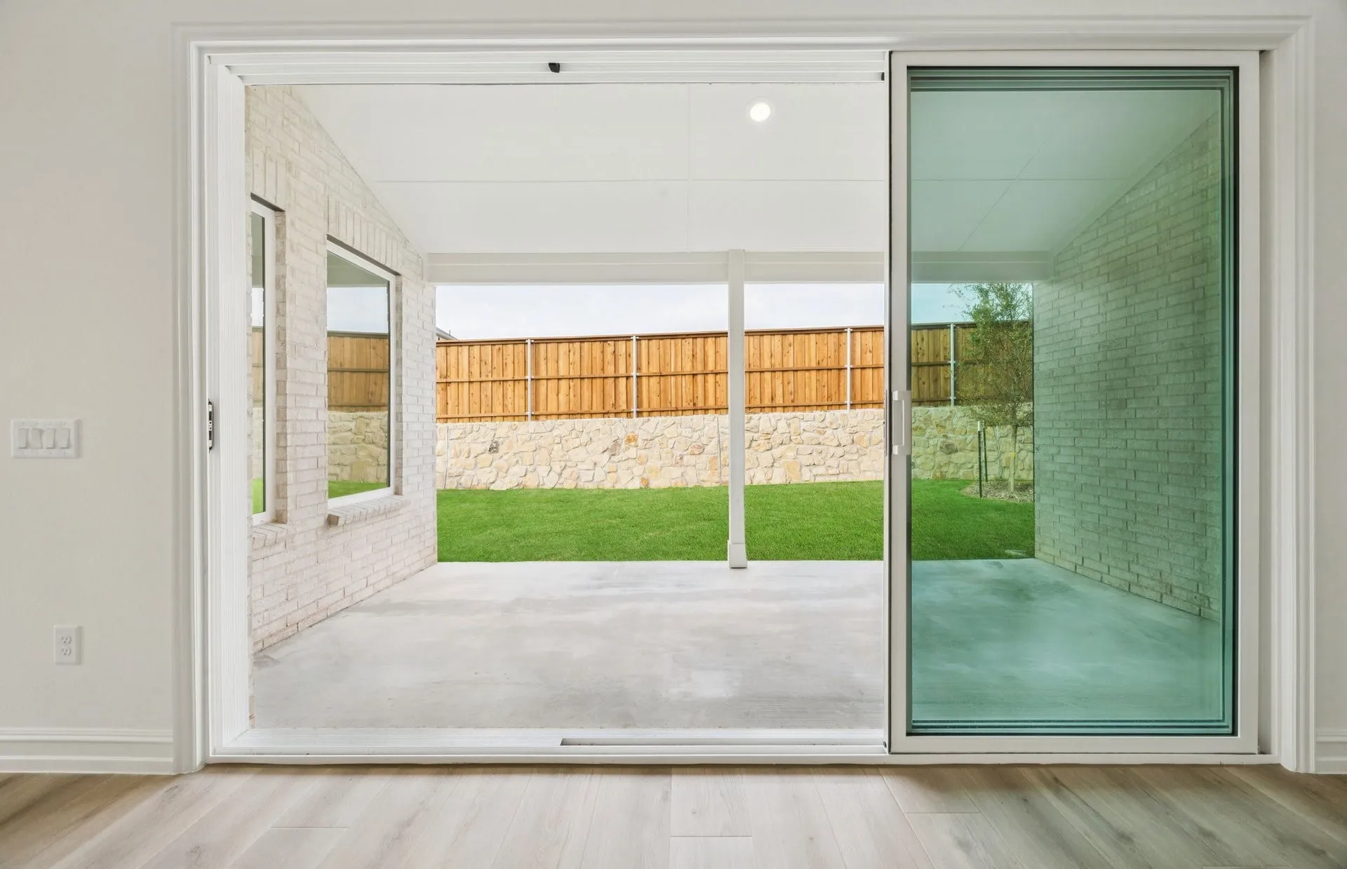 *Floorplan representation, not actual home - Spacious gathering room with sliding glass dooes
