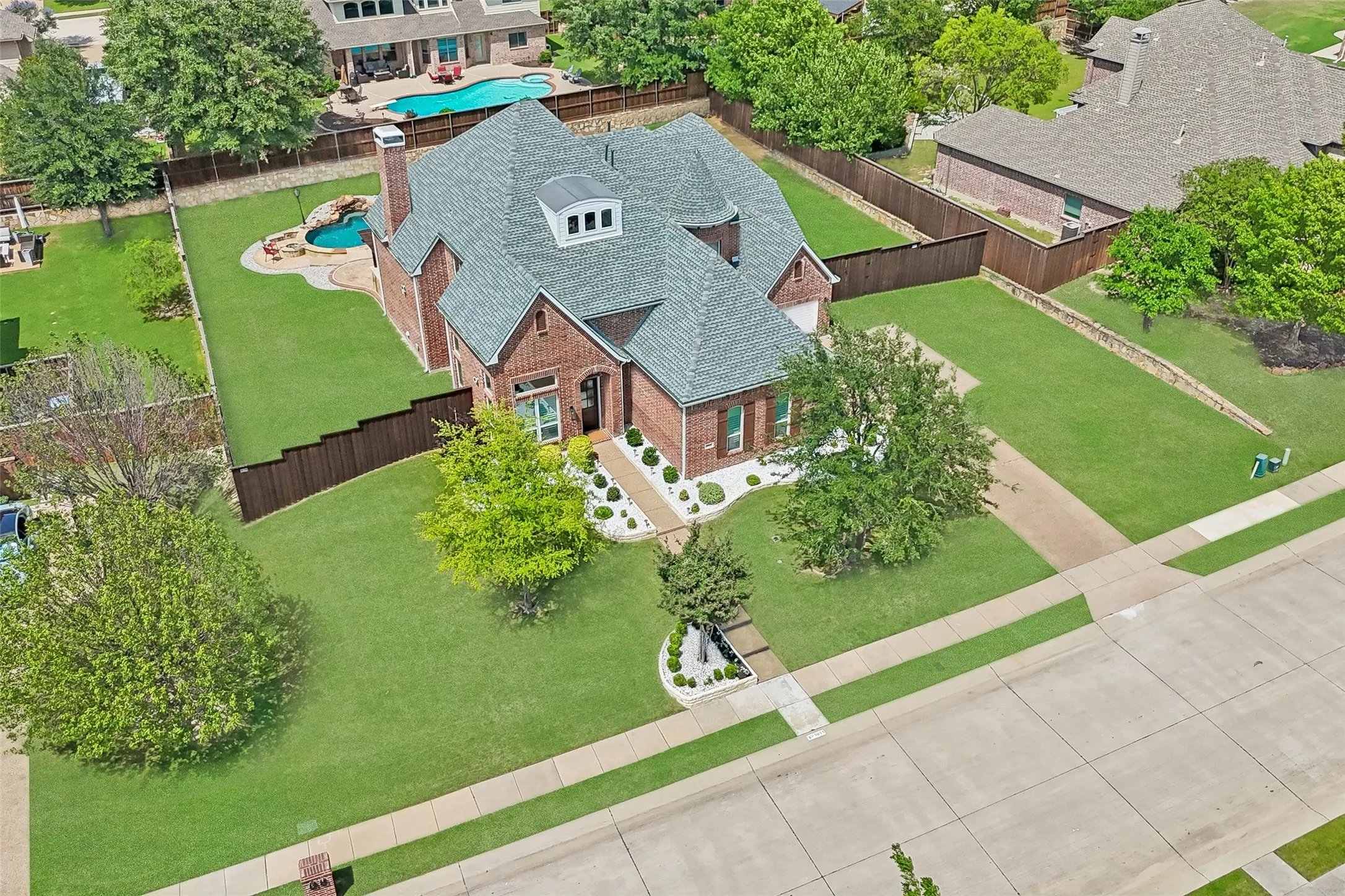 Stunning aerial view showcasing the expansive lot,
sparkling pool, and generous outdoor space.
