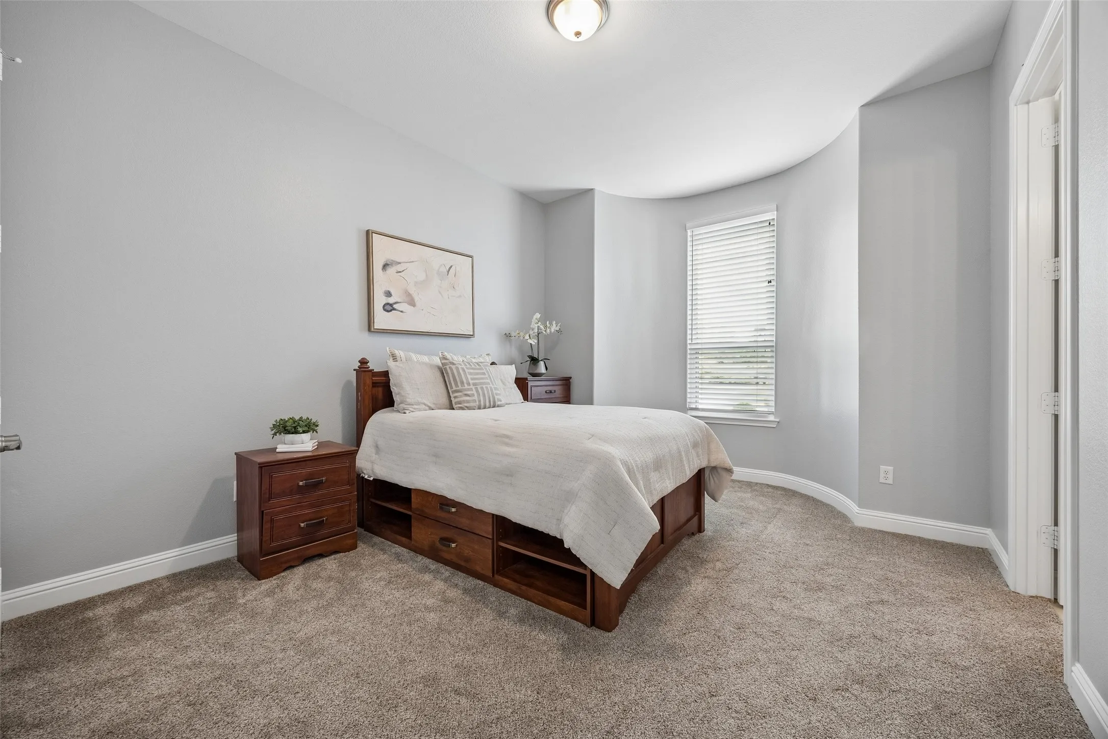 Private downstairs guest suite with soft natural
light and easy access to a beautifully updated
ensuite bath, ideal for guests or multigenerational
living.