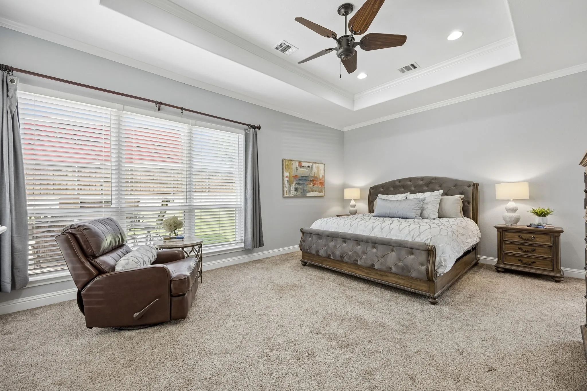 Spacious primary suite with tray ceiling, abundant
natural light, and generous room for a sitting area,
creating a true private retreat.