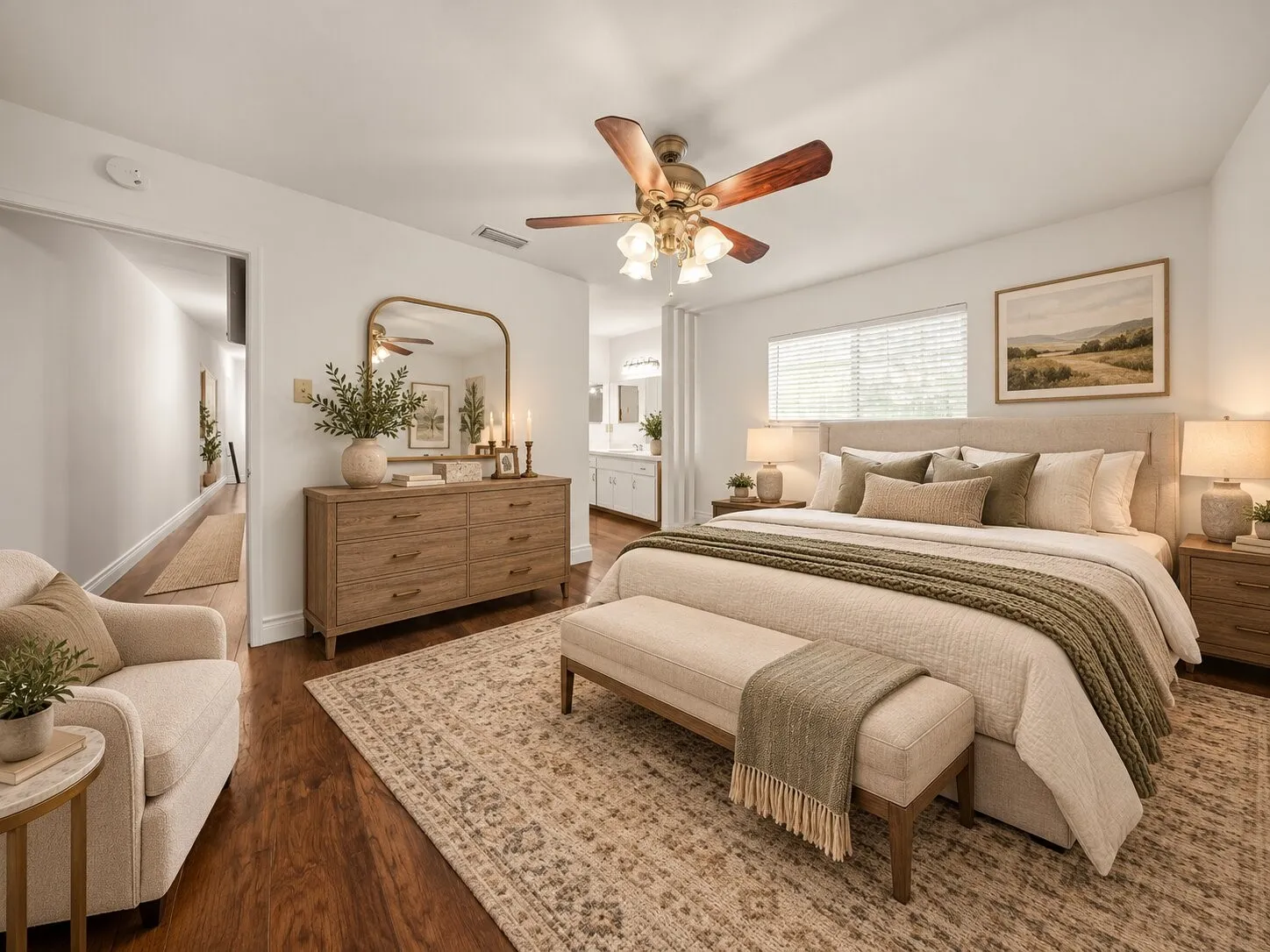 Spacious room featuring wood-finish flooring, a ceiling fan with integrated lighting, and horizontal window blinds