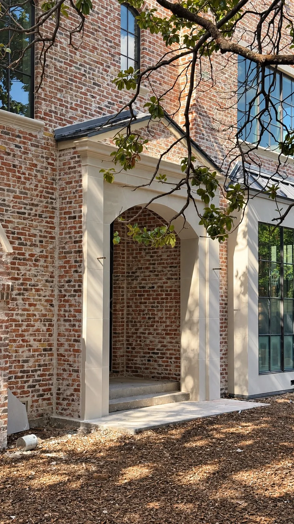 Natural "Chicago Blend" brick with stucco and cast stone accents. Lincoln Bronze aluminum clad windows.