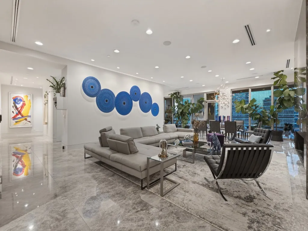 Spacious interior featuring marble-finish flooring and extensive recessed lighting