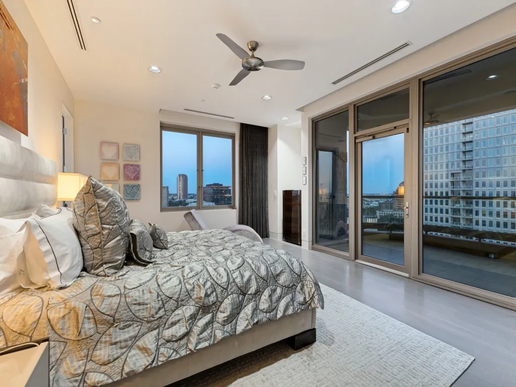 Recessed lighting, ceiling fan, expansive windows, glass-paneled door, and wood-finish flooring