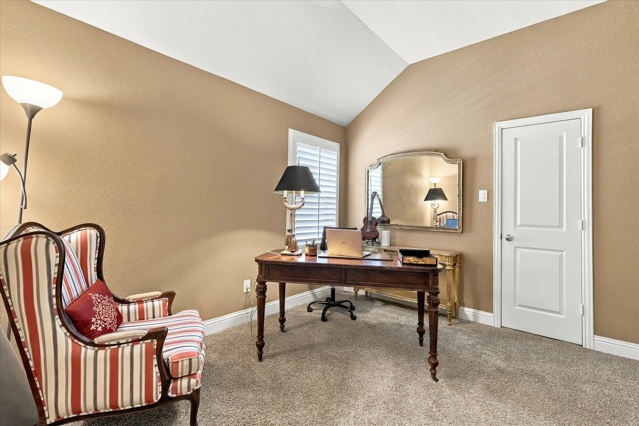 Secluded guest bedroom that is split from rest of home, currently used as second office with a walk in closet.