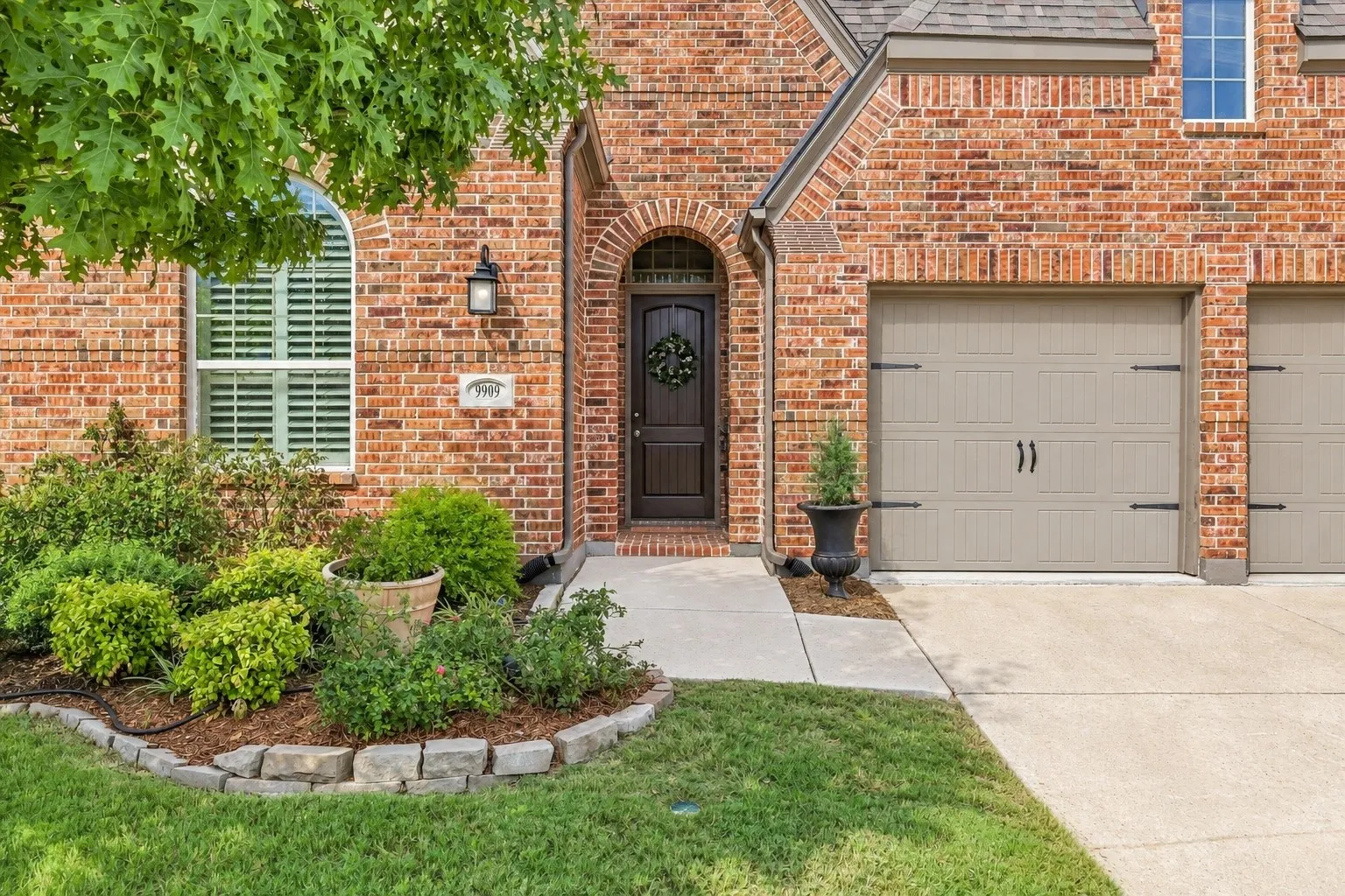 Curb appeal galore! This brick home has a three car garage, beautiful and elegant peaks and warm welcome.