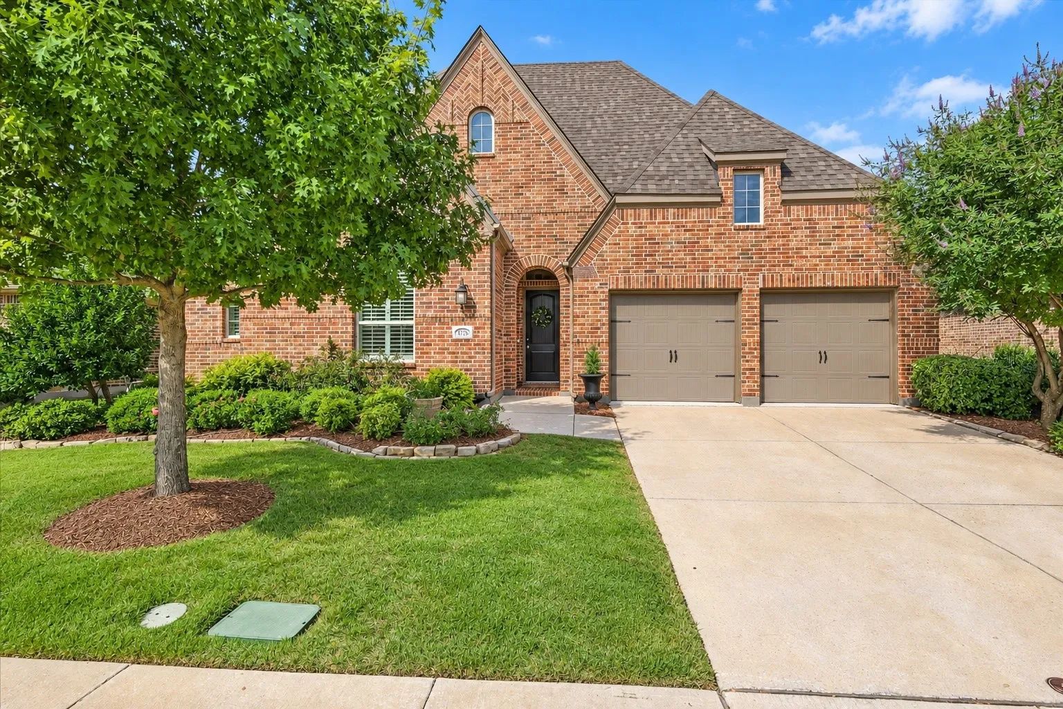 Curb appeal galore! This brick home has a three car garage, beautiful and elegant peaks and warm welcome.