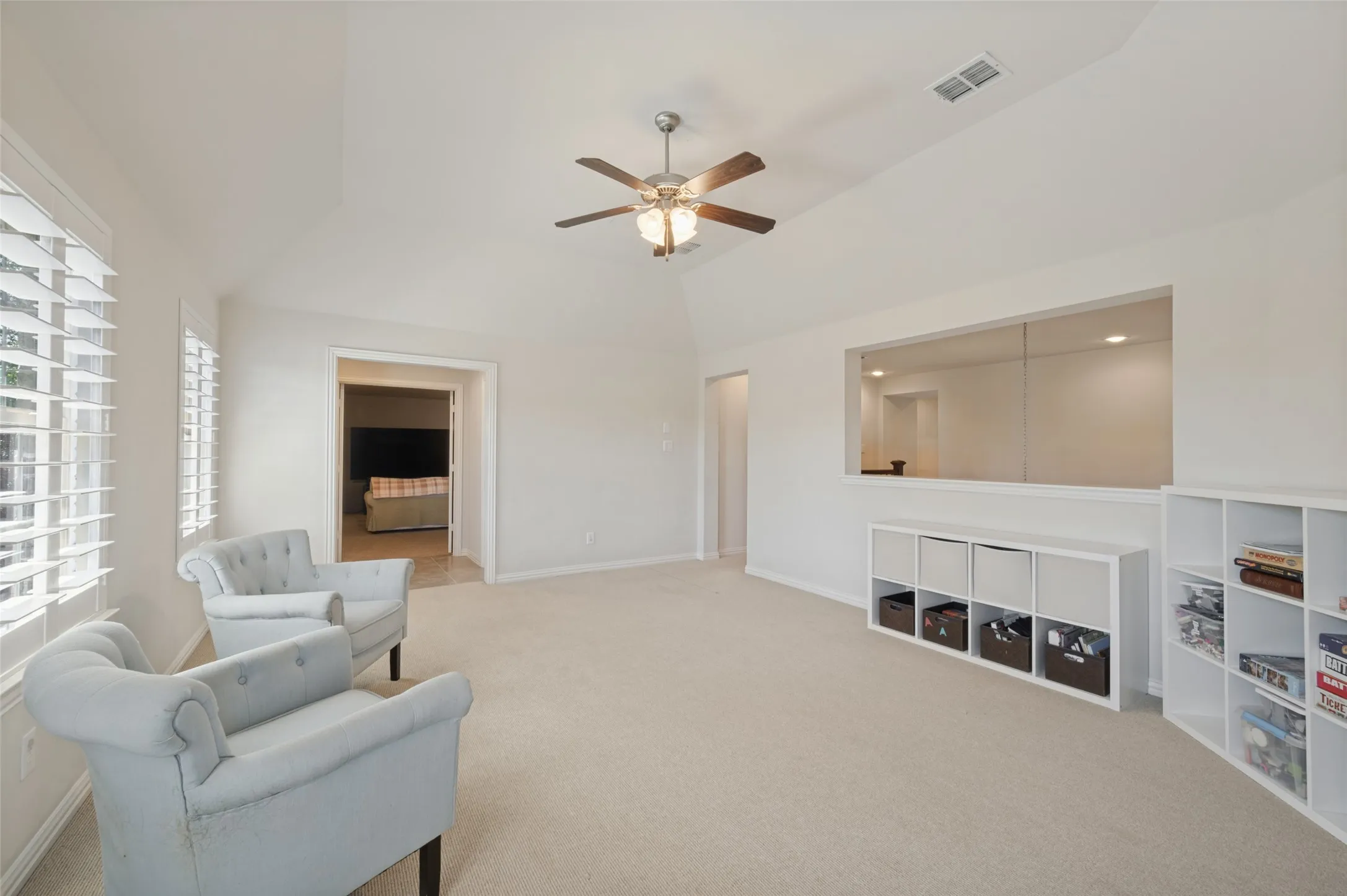Upstairs game room with a wet bar, offering additional space for relaxing and entertaining.