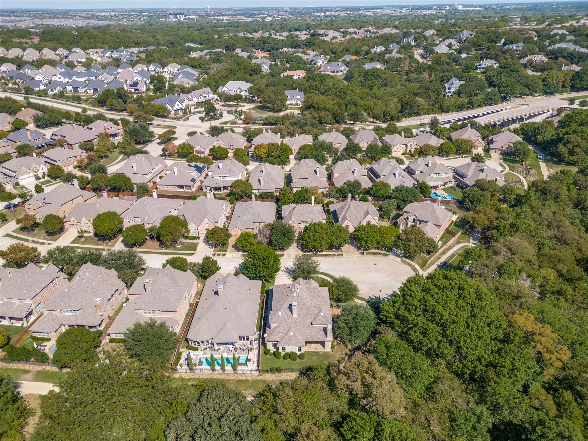 Beautiful curb appeal welcomes you to this five bedroom Highland home, tucked along a greenbelt on a quiet cul de sac in Stonebridge Ranch.