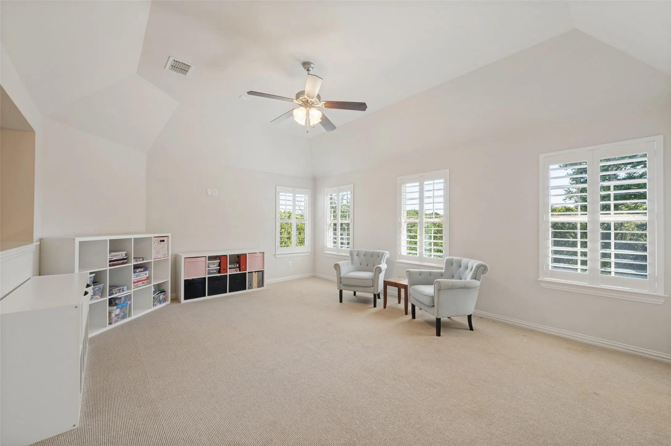Upstairs game room with a wet bar, offering additional space for relaxing and entertaining.