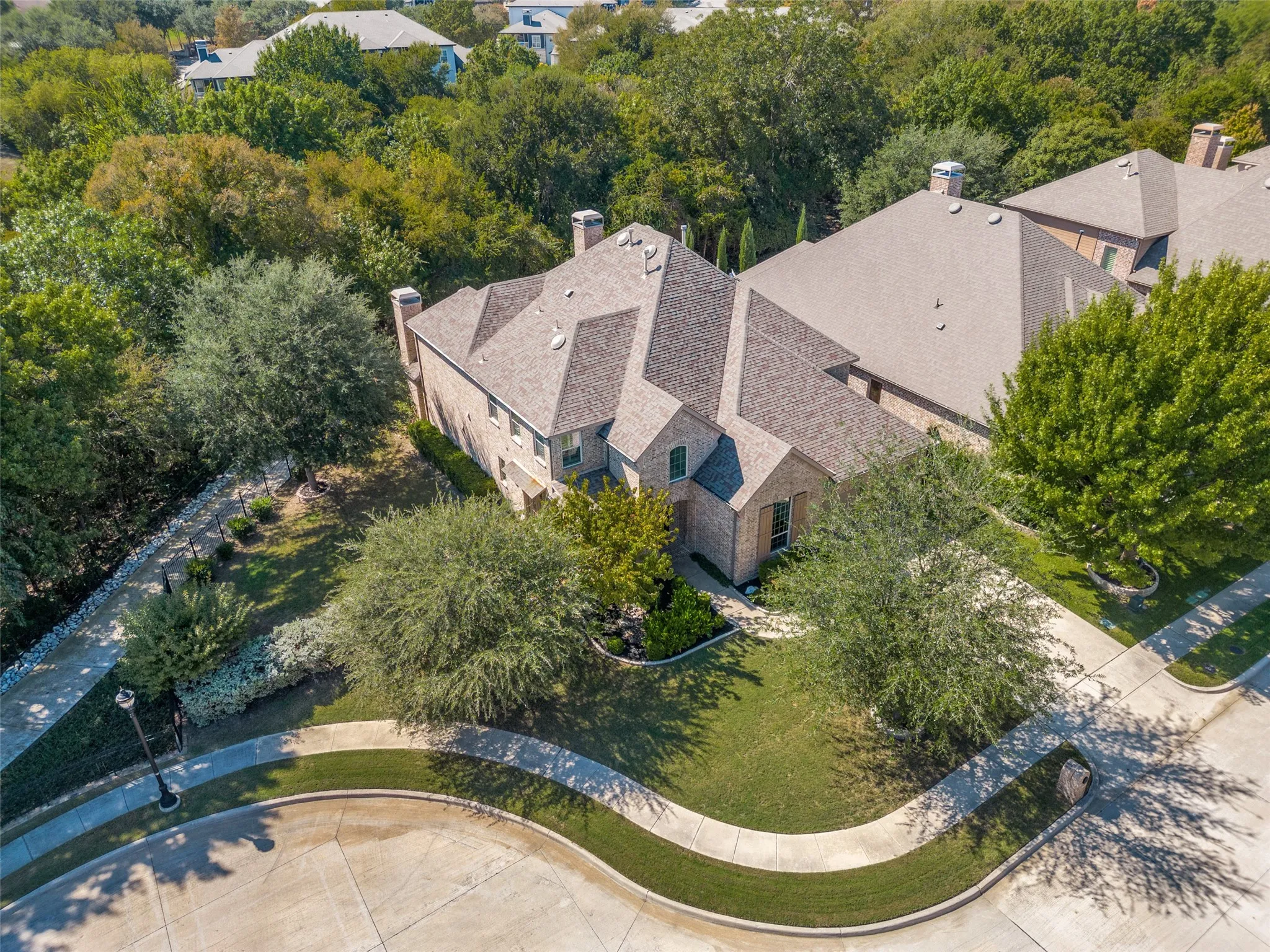 Beautiful curb appeal welcomes you to this five bedroom Highland home, tucked along a greenbelt on a quiet cul de sac in Stonebridge Ranch.