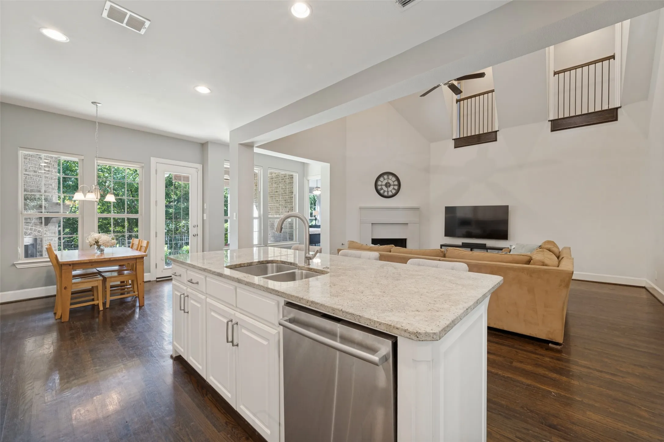 Chef’s kitchen with a large center island, five burner gas cooktop, double ovens, range hood and butler’s pantry.
