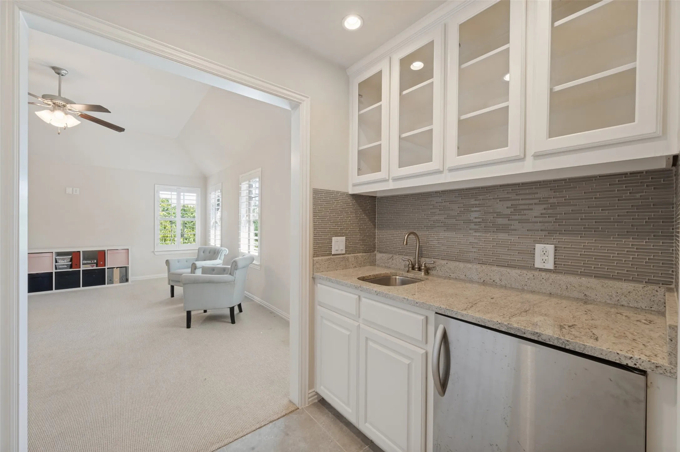 Convenient wet bar located between the game room and media room.
