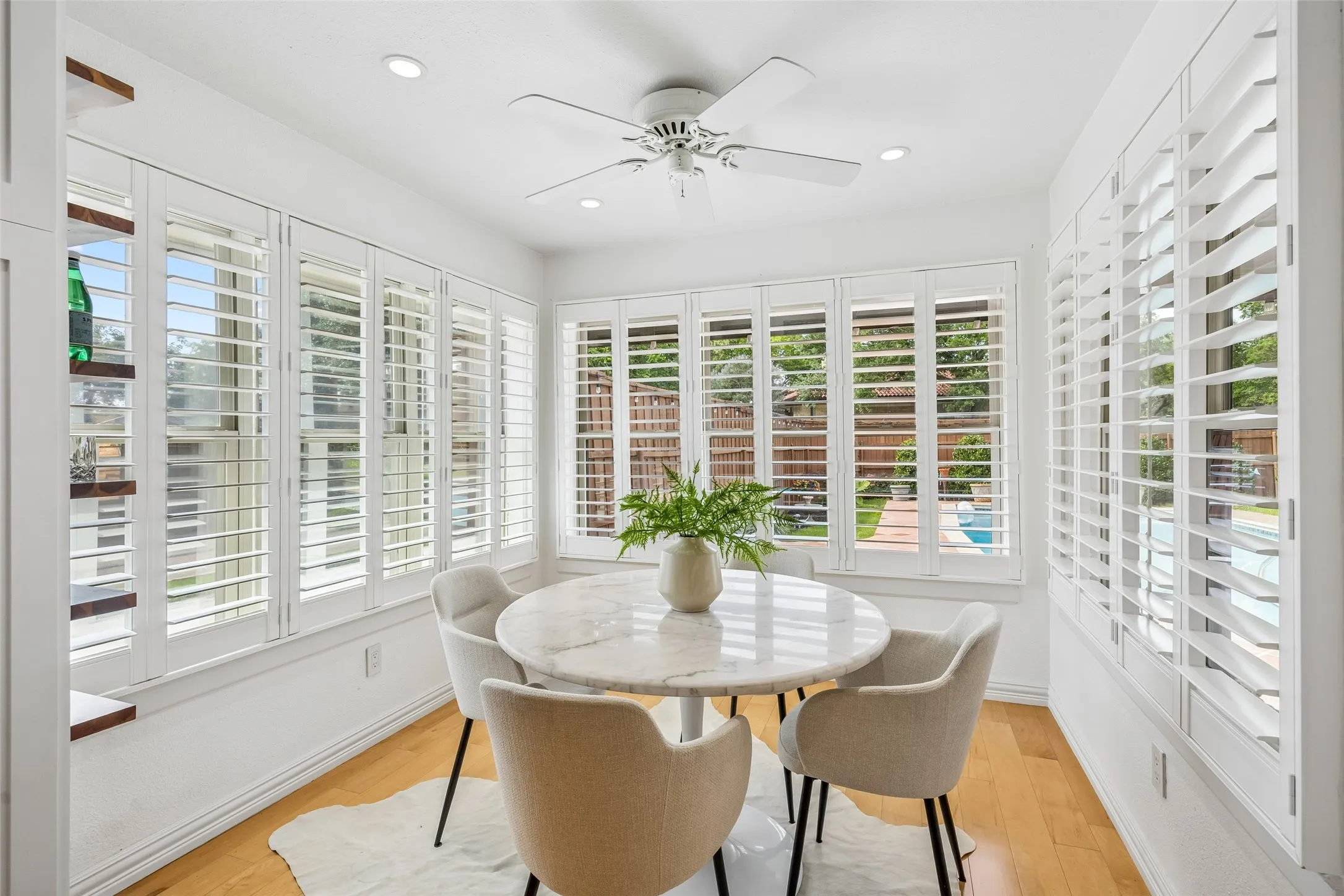 Enjoy your morning coffee overlooking the spacious backyard and pool.