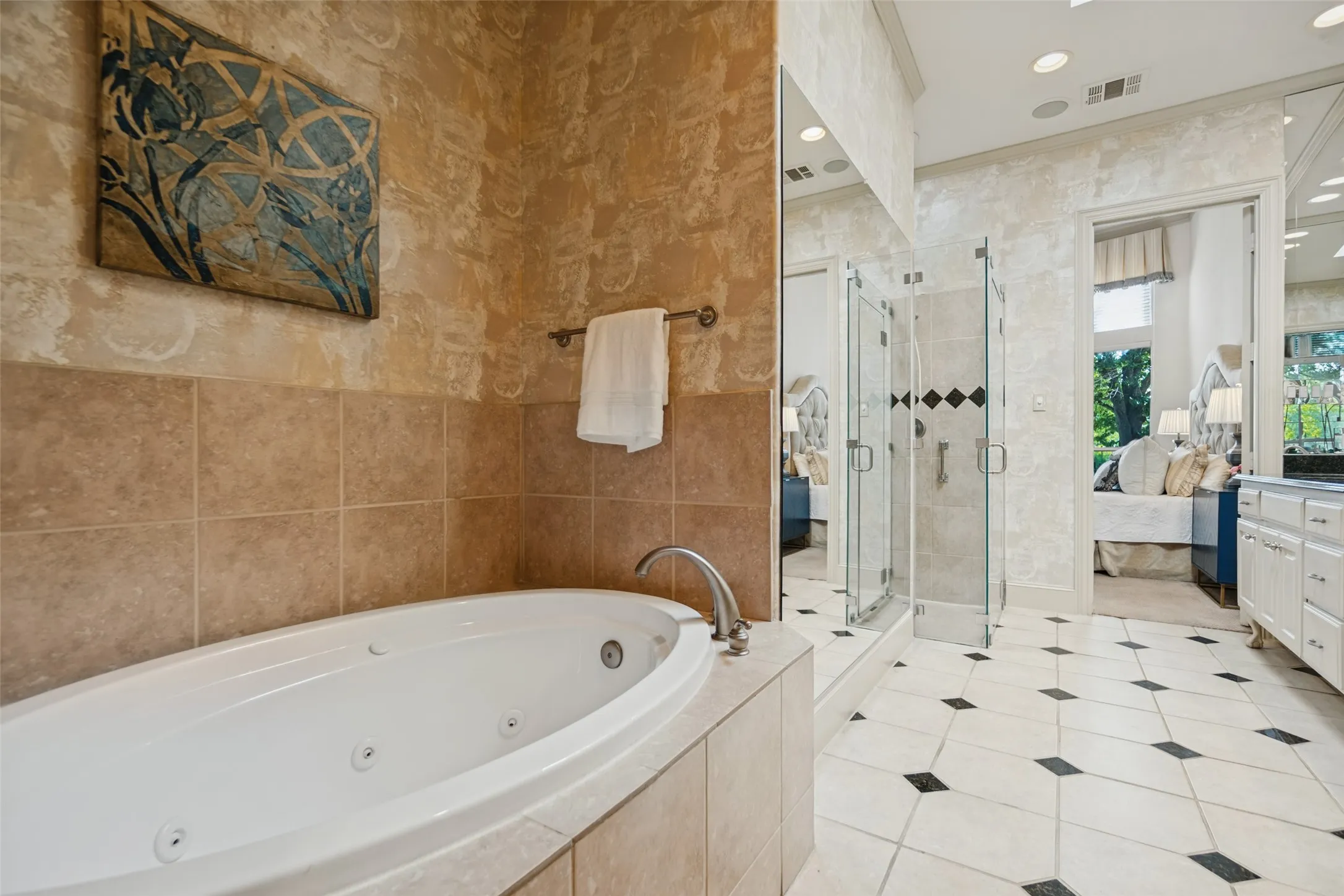 Primary bathroom with tub and shower