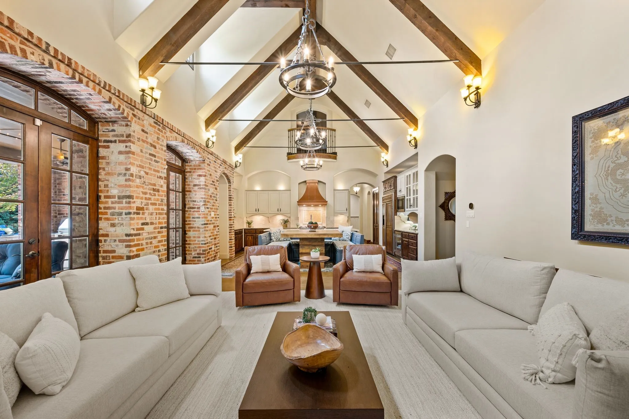 Grand yet inviting, this beautifully designed great room offers the perfect setting for entertaining on a large scale while maintaining the warmth and intimacy of a more personal gathering.