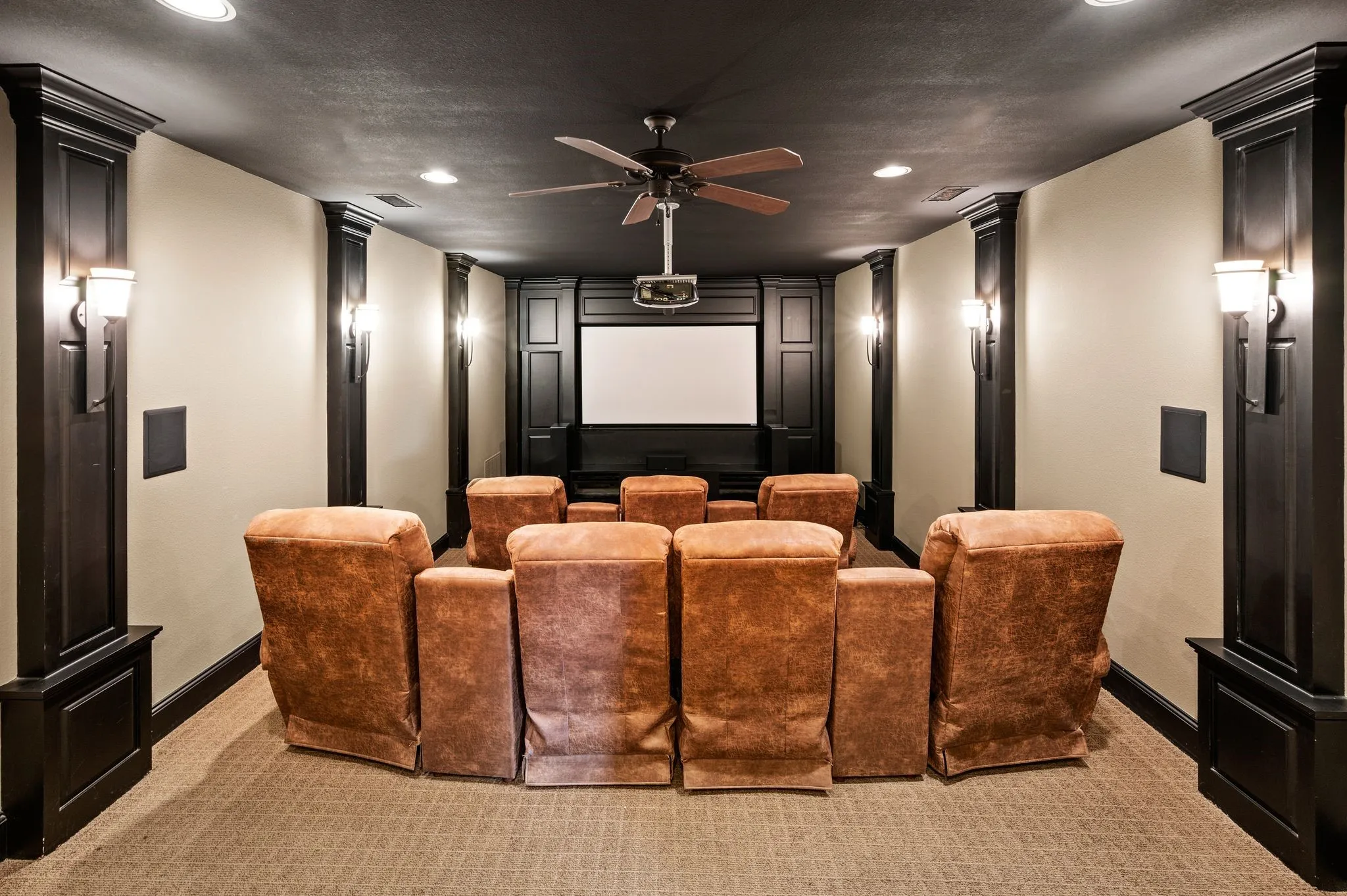 The perfect setting for movie nights and entertaining, this dedicated media room offers comfortable seating for seven and an inviting cinematic experience.