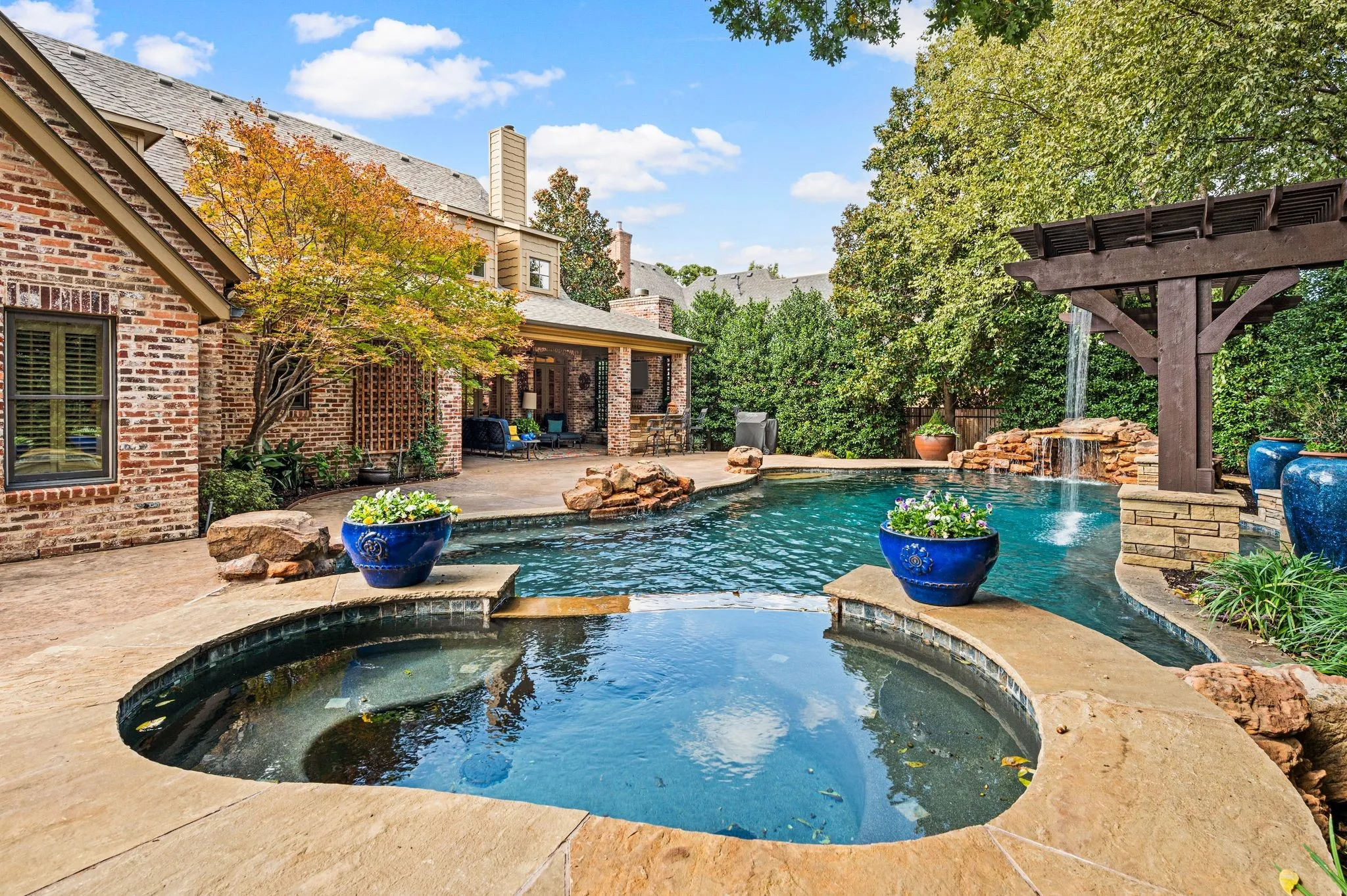 This beautifully secluded backyard offers a private, tranquil retreat, creating the feeling of being worlds away while remaining just minutes from the premier shopping, dining, and entertainment of Southlake Town Square.